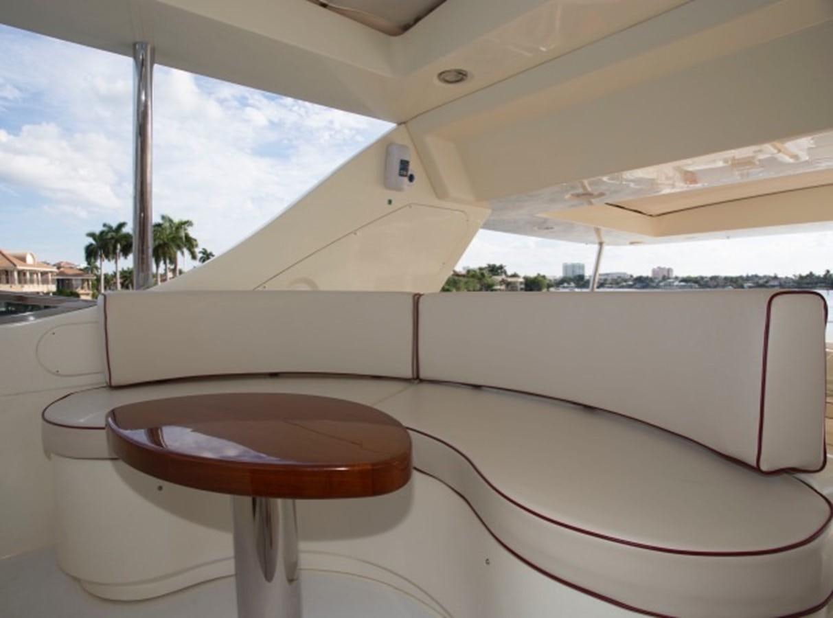 a table on a boat aboard MOMENTO.   2006 AZIMUT 116 @ Yacht for Sale