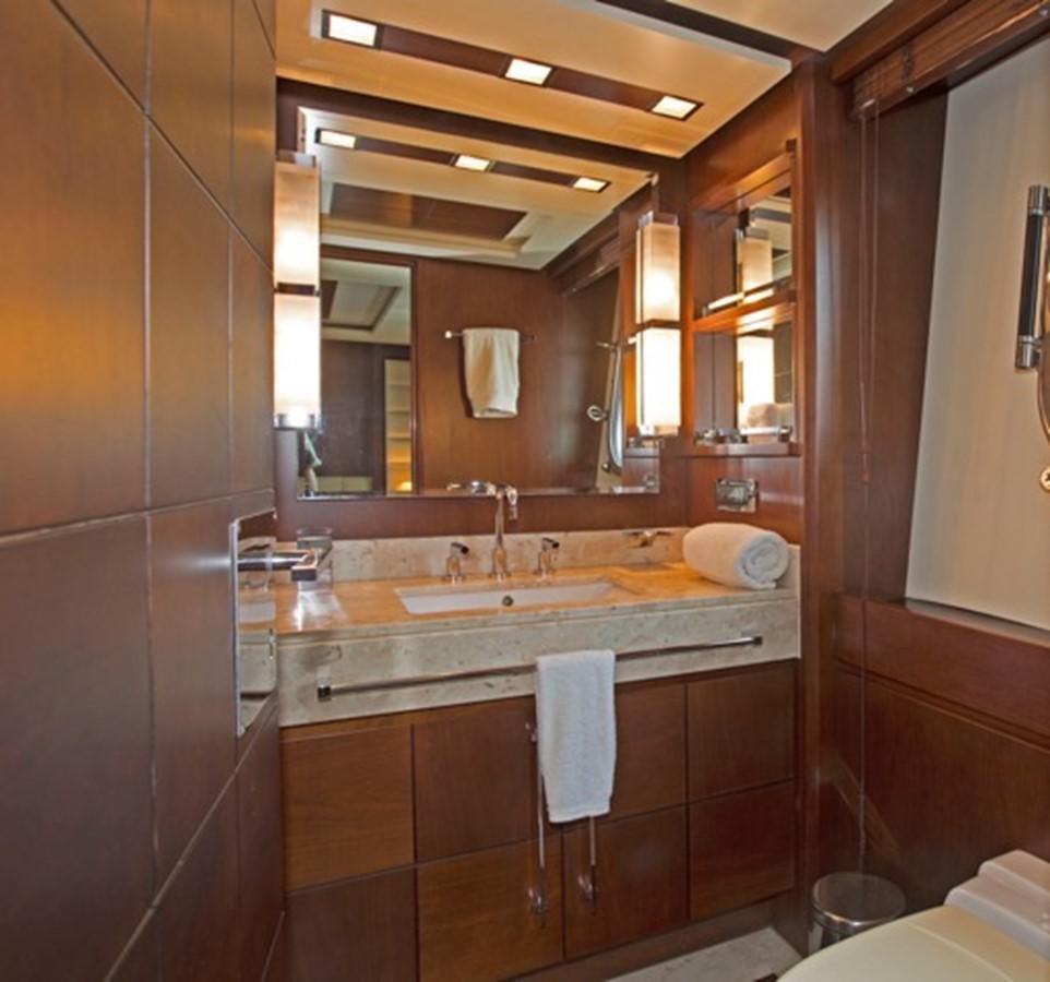 a bathroom with a large mirror aboard MOMENTO.   2006 AZIMUT 116 @ Yacht for Sale