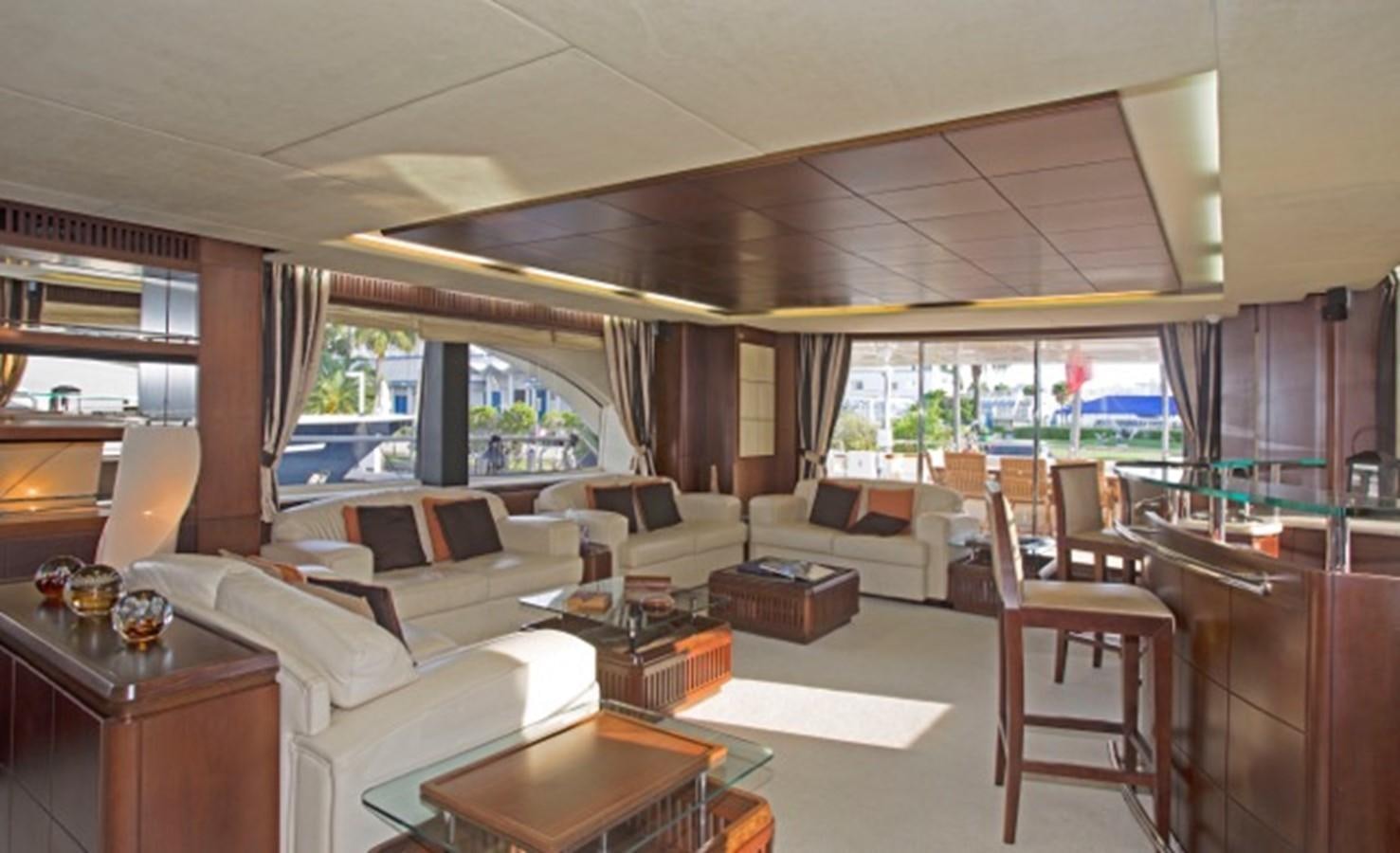 a living room with a large window aboard MOMENTO.   2006 AZIMUT 116 @ Yacht for Sale
