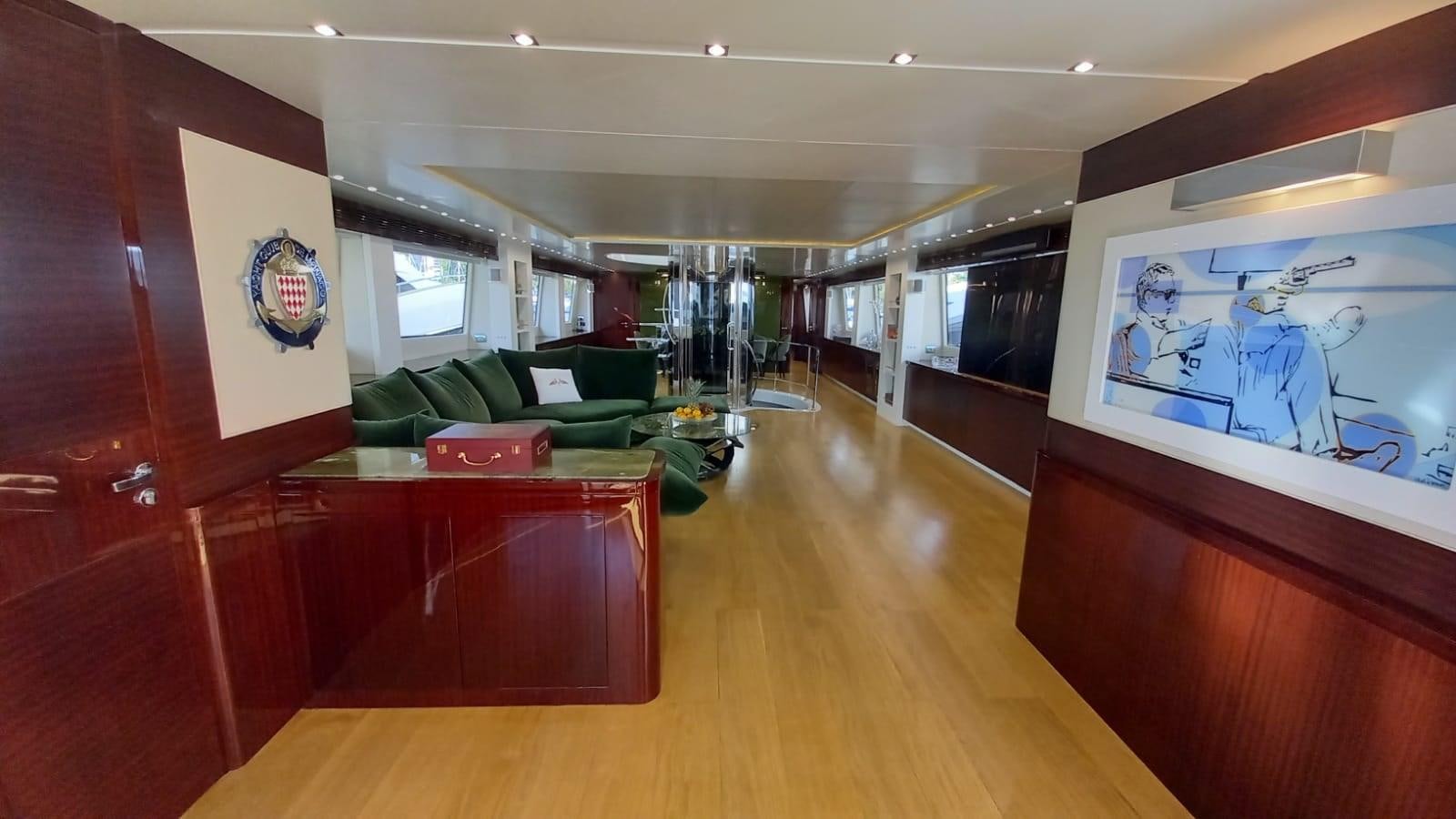 a room with a couch and a television aboard FREEDOM Yacht for Sale