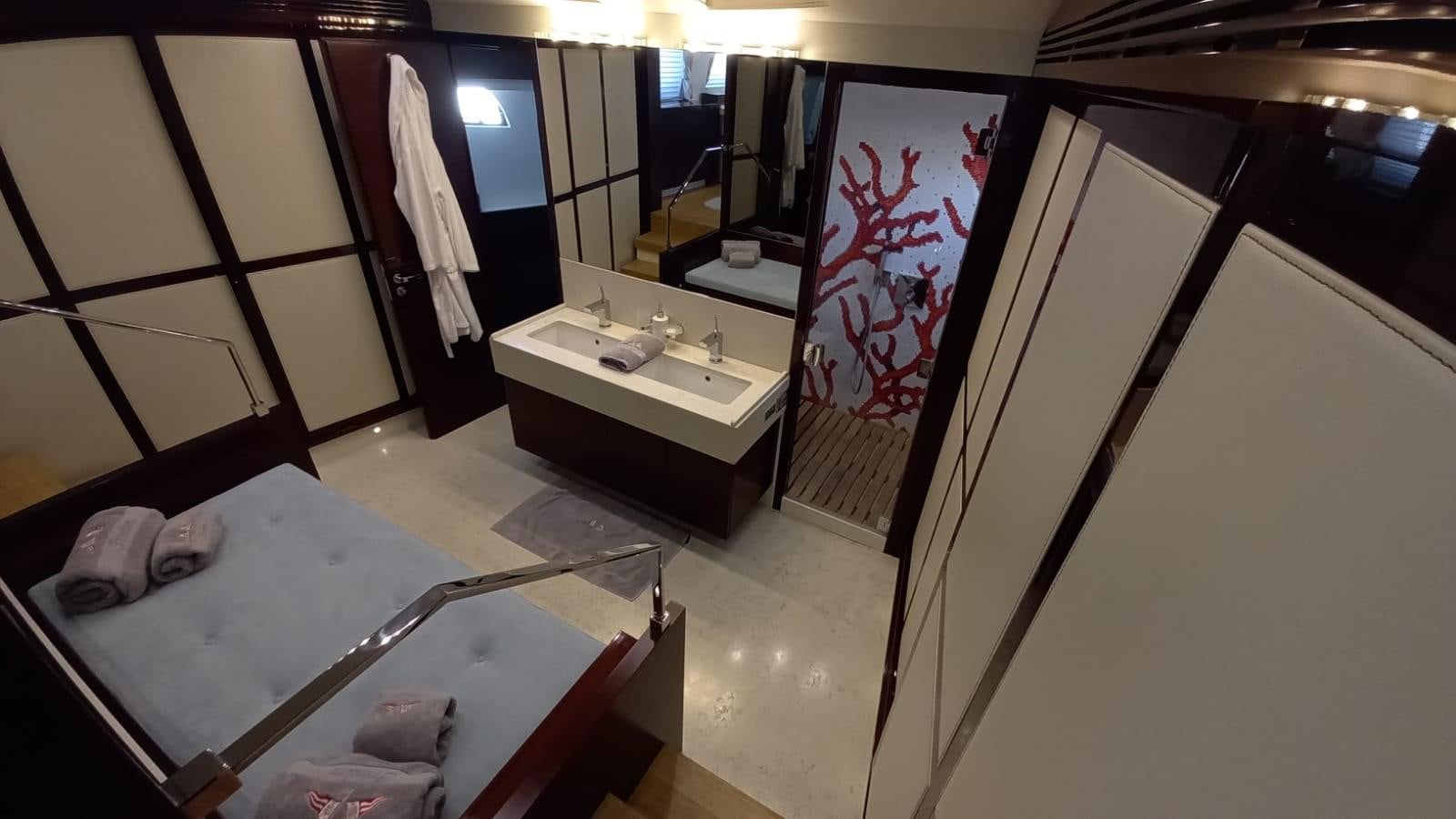 a bathroom with a large mirror aboard FREEDOM Yacht for Sale