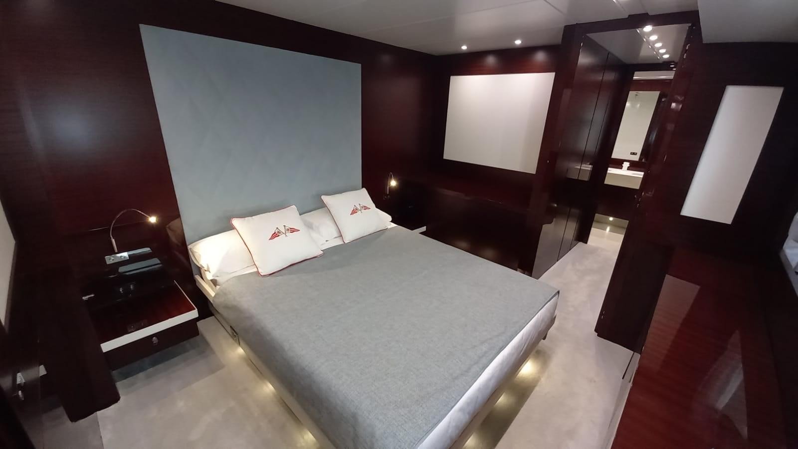 a bed in a room aboard FREEDOM Yacht for Sale