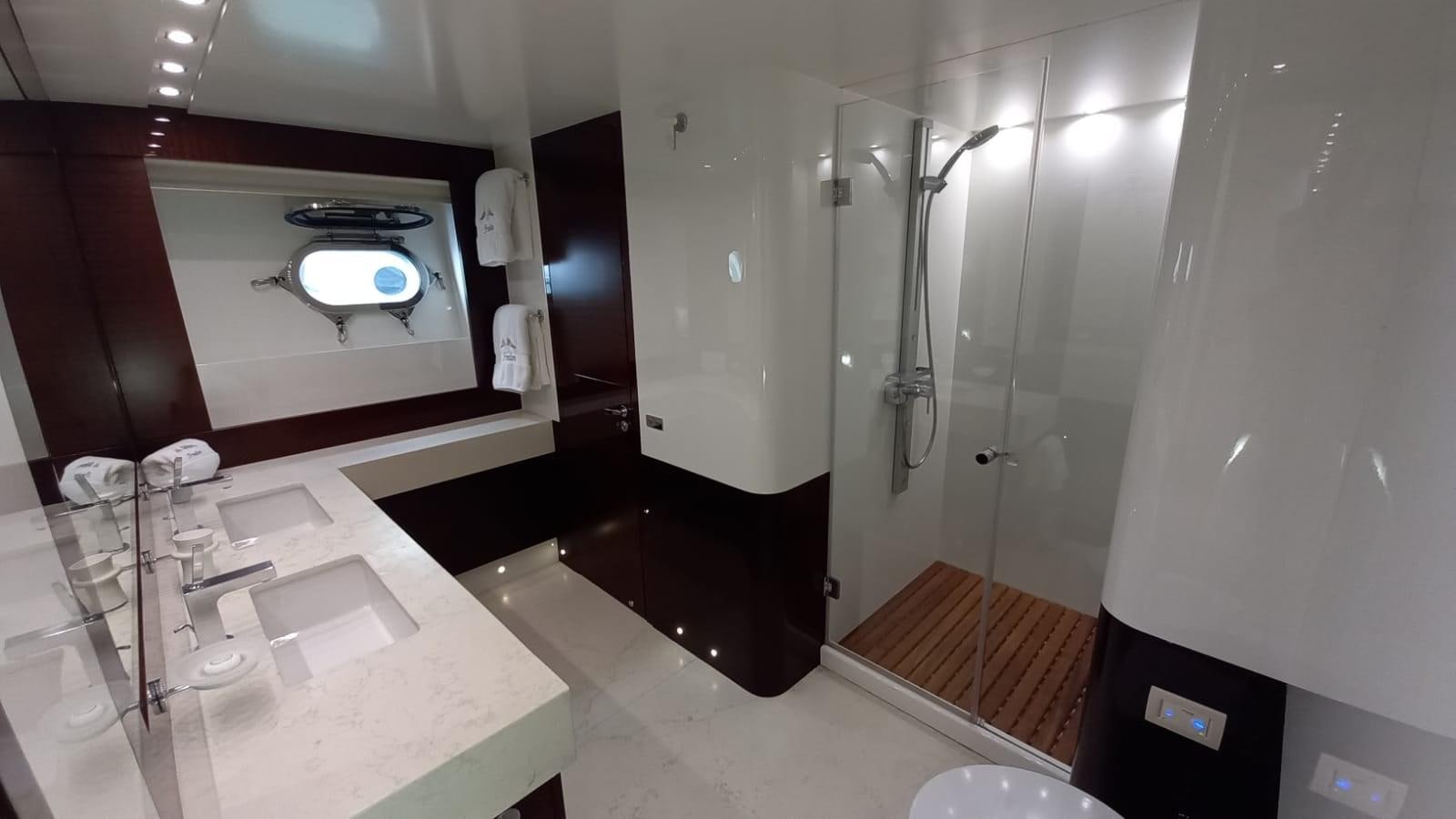 a bathroom with a large mirror aboard FREEDOM Yacht for Sale