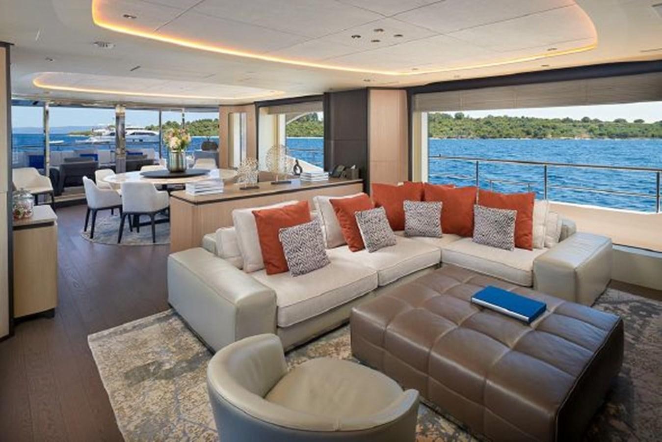 a living room with a couch and a table aboard 2018 BENETTI MEDITERRANEO 116 - VIRGIN ISLANDS Yacht for Sale