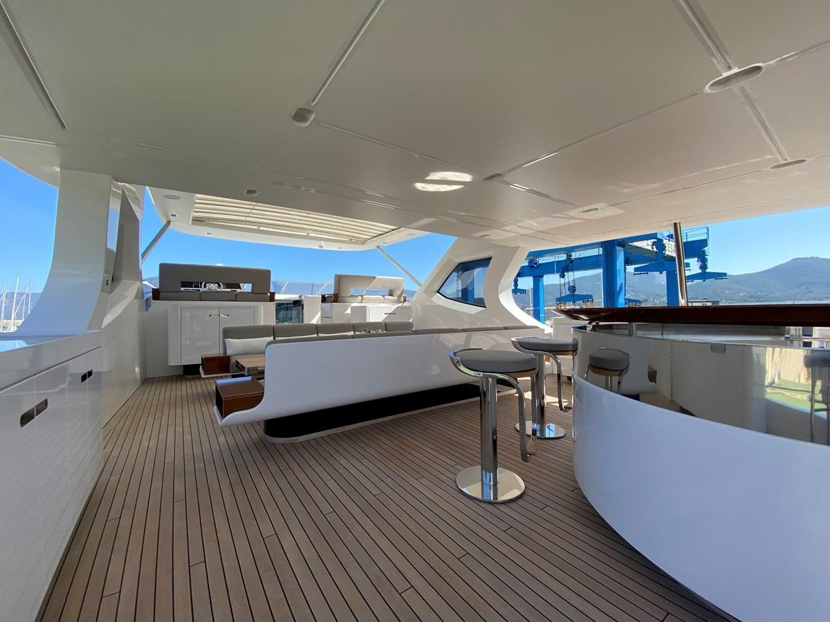 a room with a large window and a wood floor aboard PARTNER Yacht for Sale