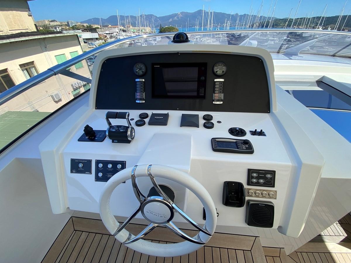 a white machine with a steering wheel aboard PARTNER Yacht for Sale