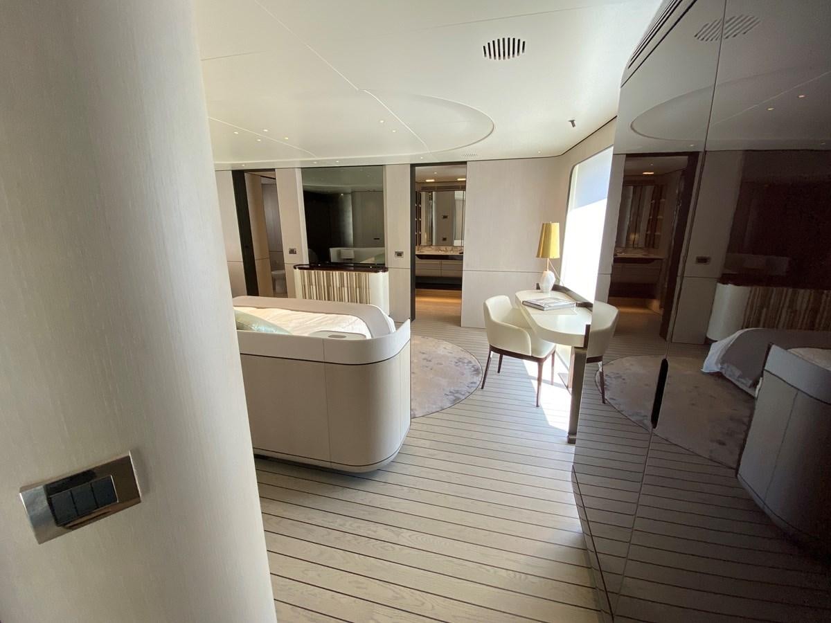 a room with a table and couches aboard PARTNER Yacht for Sale