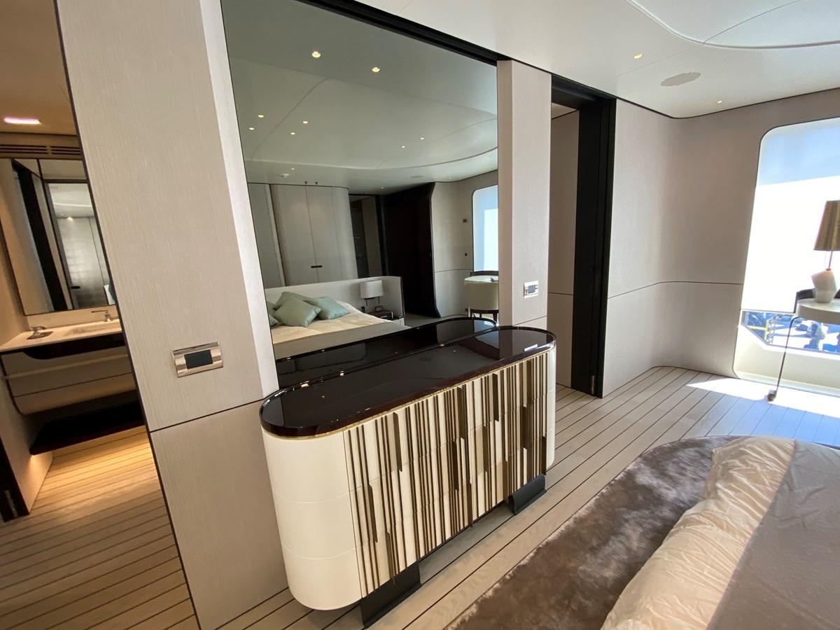 a room with a bed and a desk aboard PARTNER Yacht for Sale