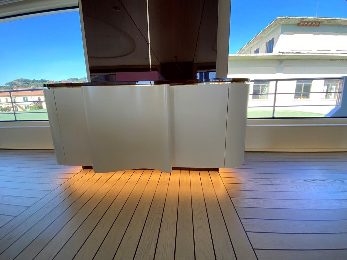 a room with a wood floor and a large window aboard PARTNER Yacht for Sale