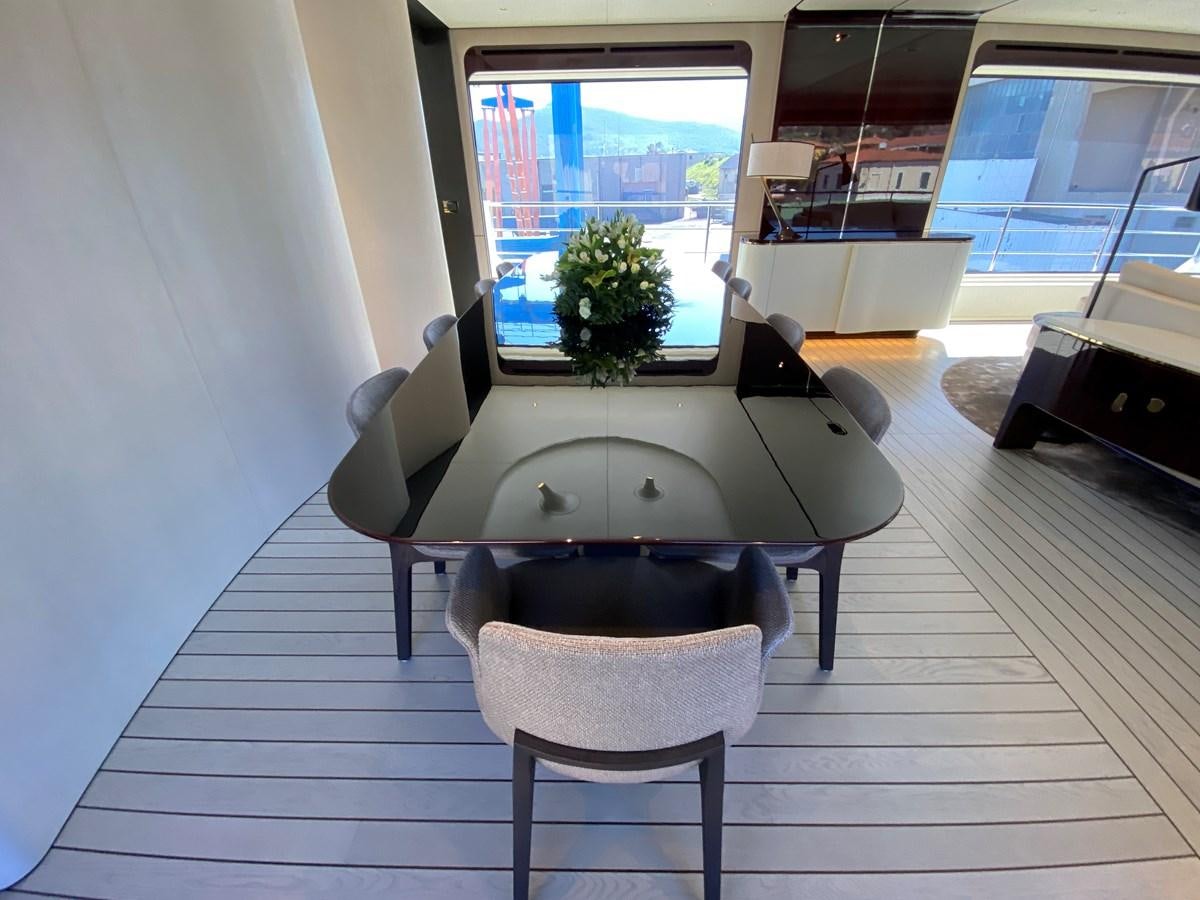 a room with a table and chairs aboard PARTNER Yacht for Sale