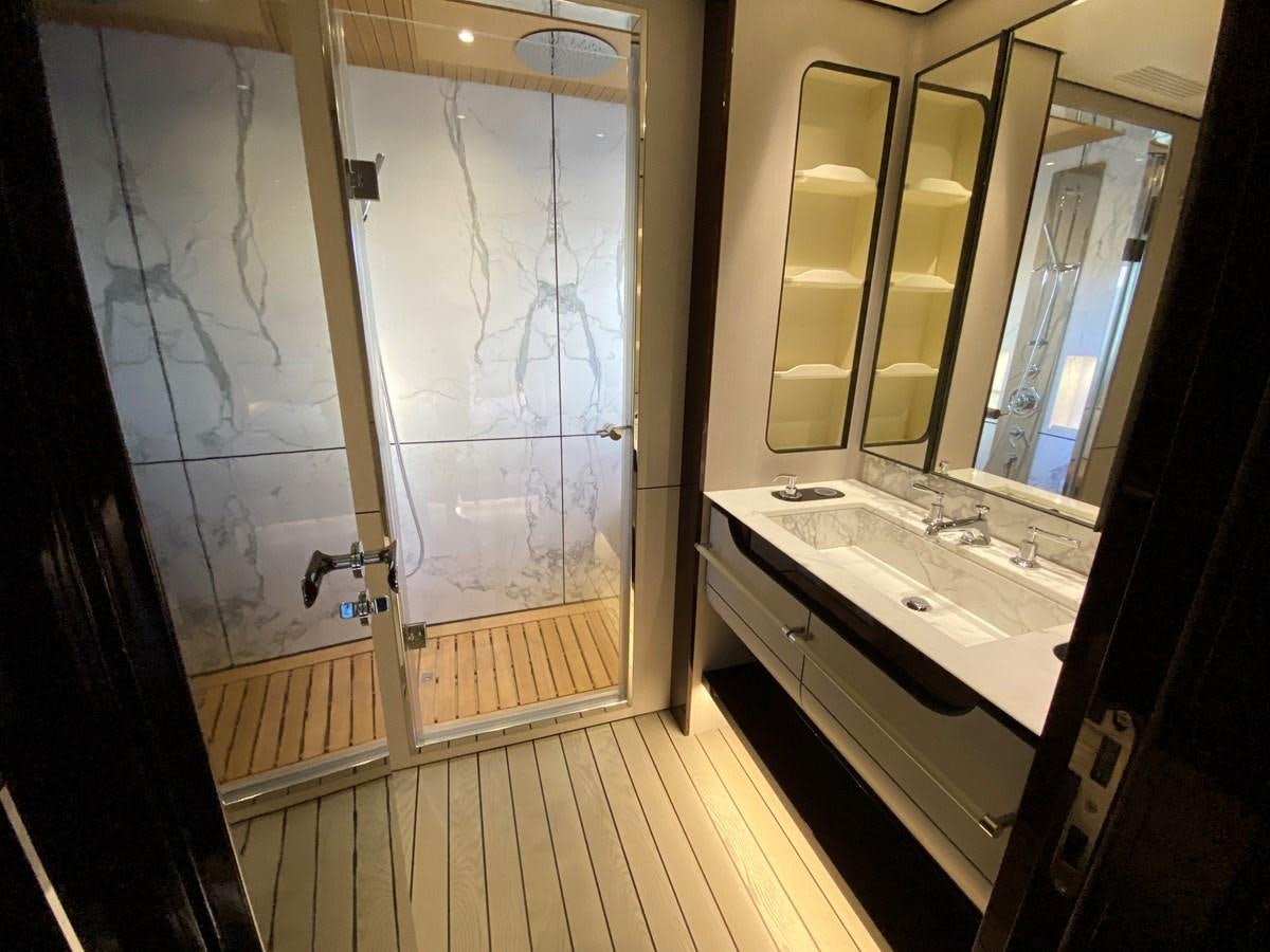 a bathroom with a large glass shower aboard PARTNER Yacht for Sale
