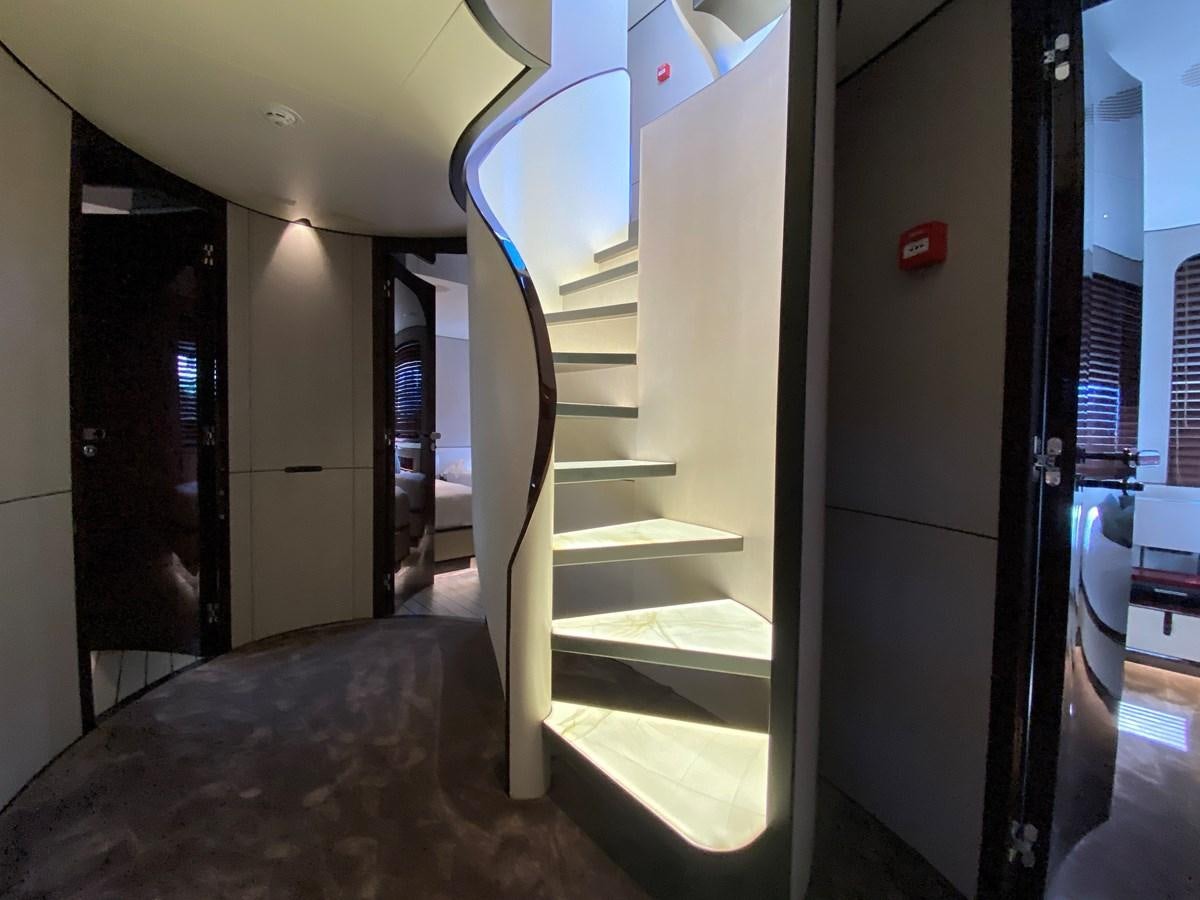 a hallway with glass doors aboard PARTNER Yacht for Sale