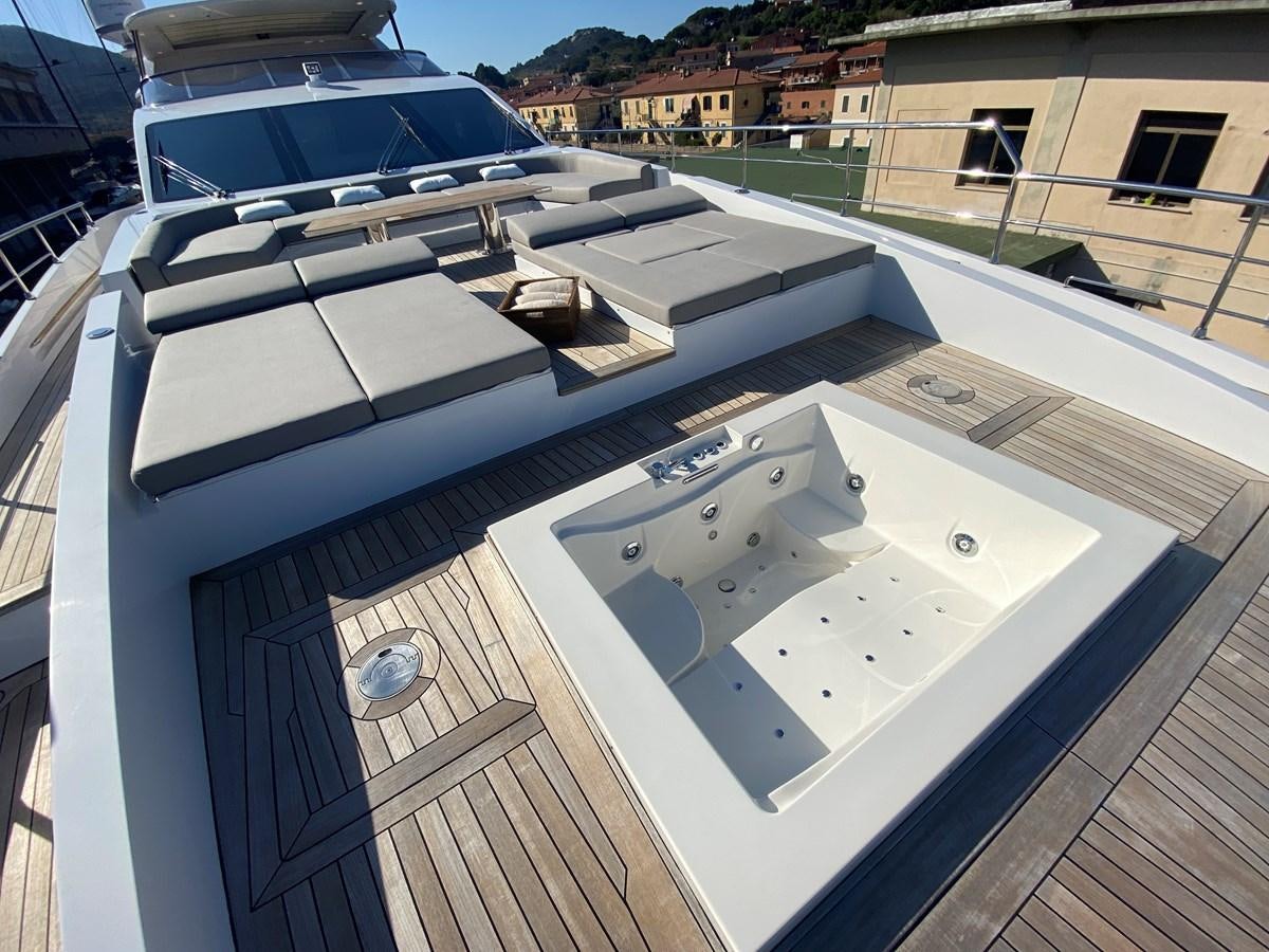 a white boat on a deck aboard PARTNER Yacht for Sale