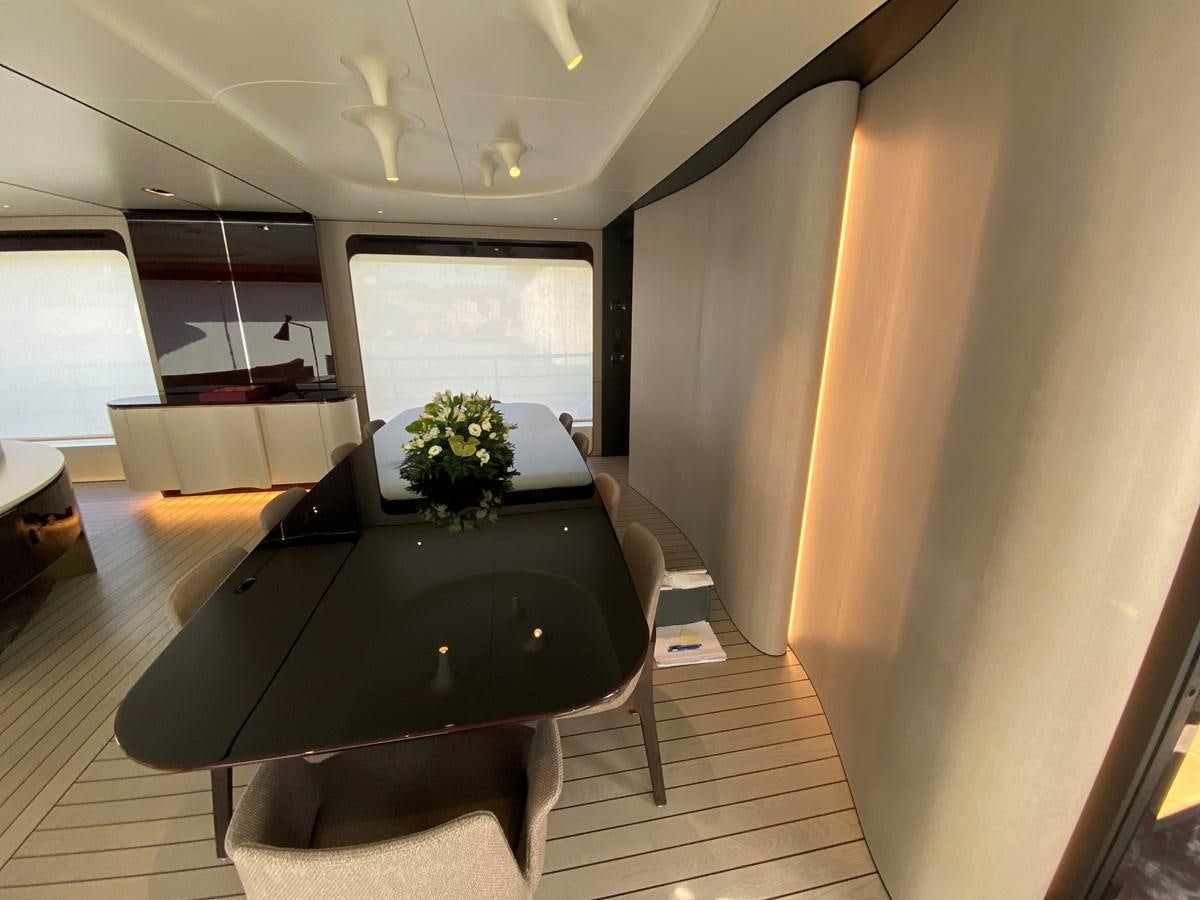 a room with a table and chairs aboard PARTNER Yacht for Sale
