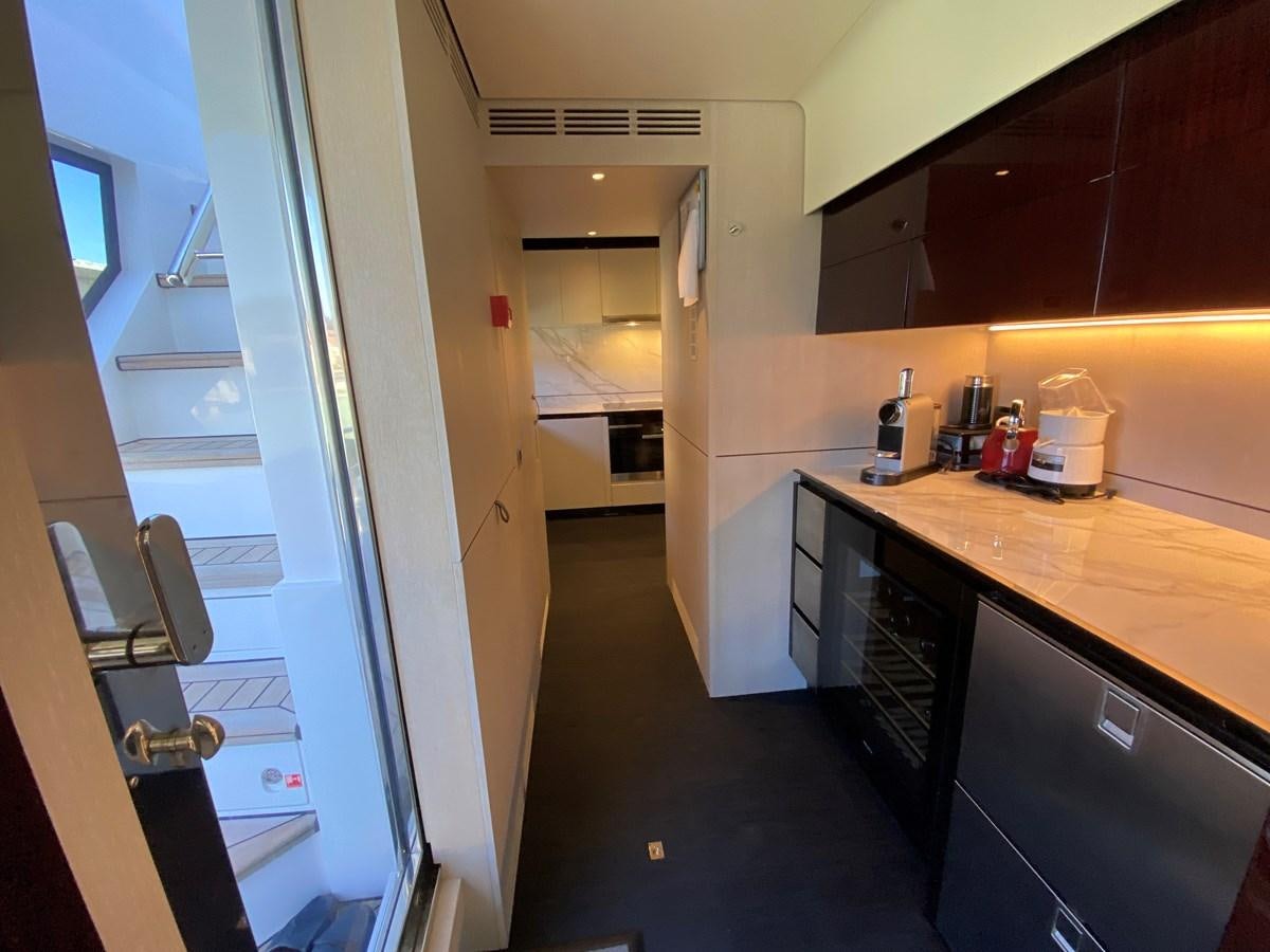 a kitchen with a counter and cabinets aboard PARTNER Yacht for Sale