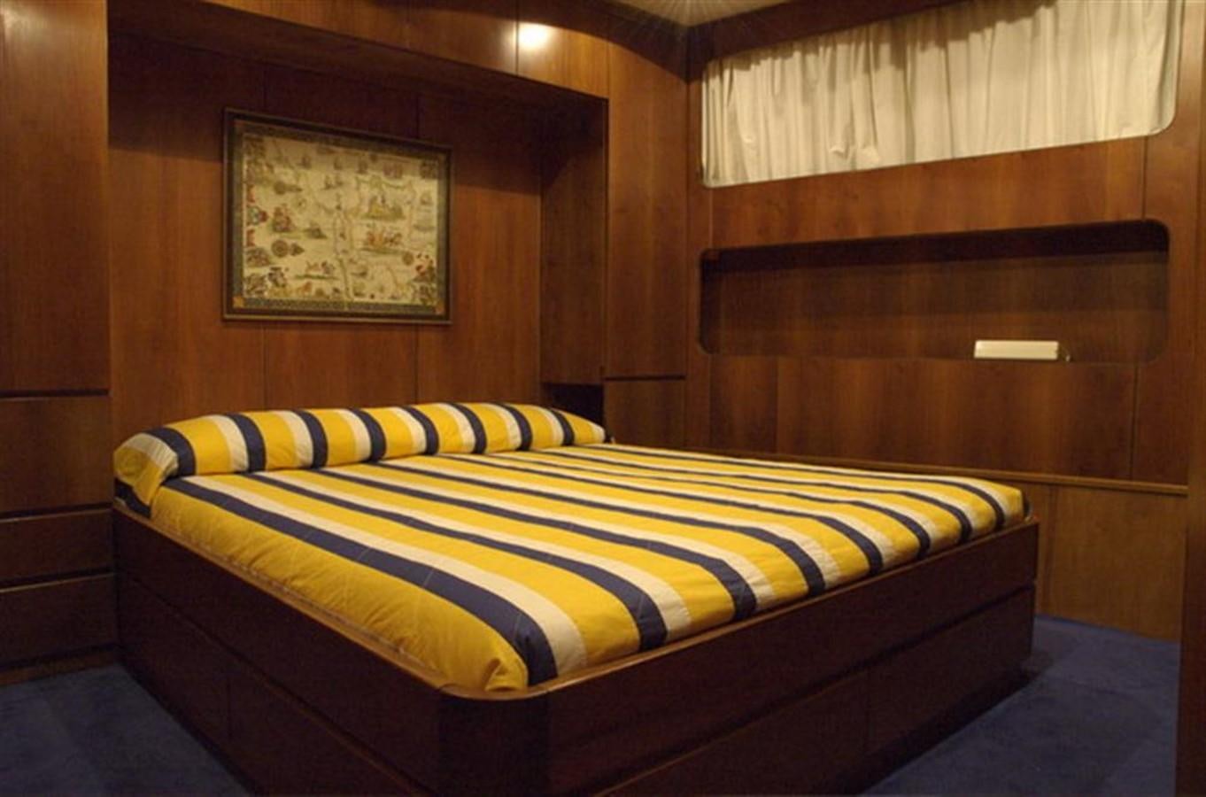 a bed in a room aboard BARCABLU Yacht for Sale