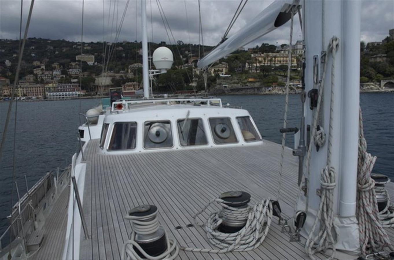 a white boat on a body of water aboard BARCABLU Yacht for Sale