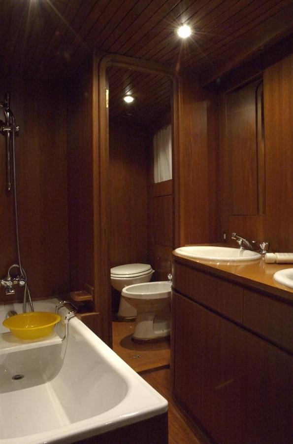 a bathroom with a sink toilet and a bathtub aboard BARCABLU Yacht for Sale