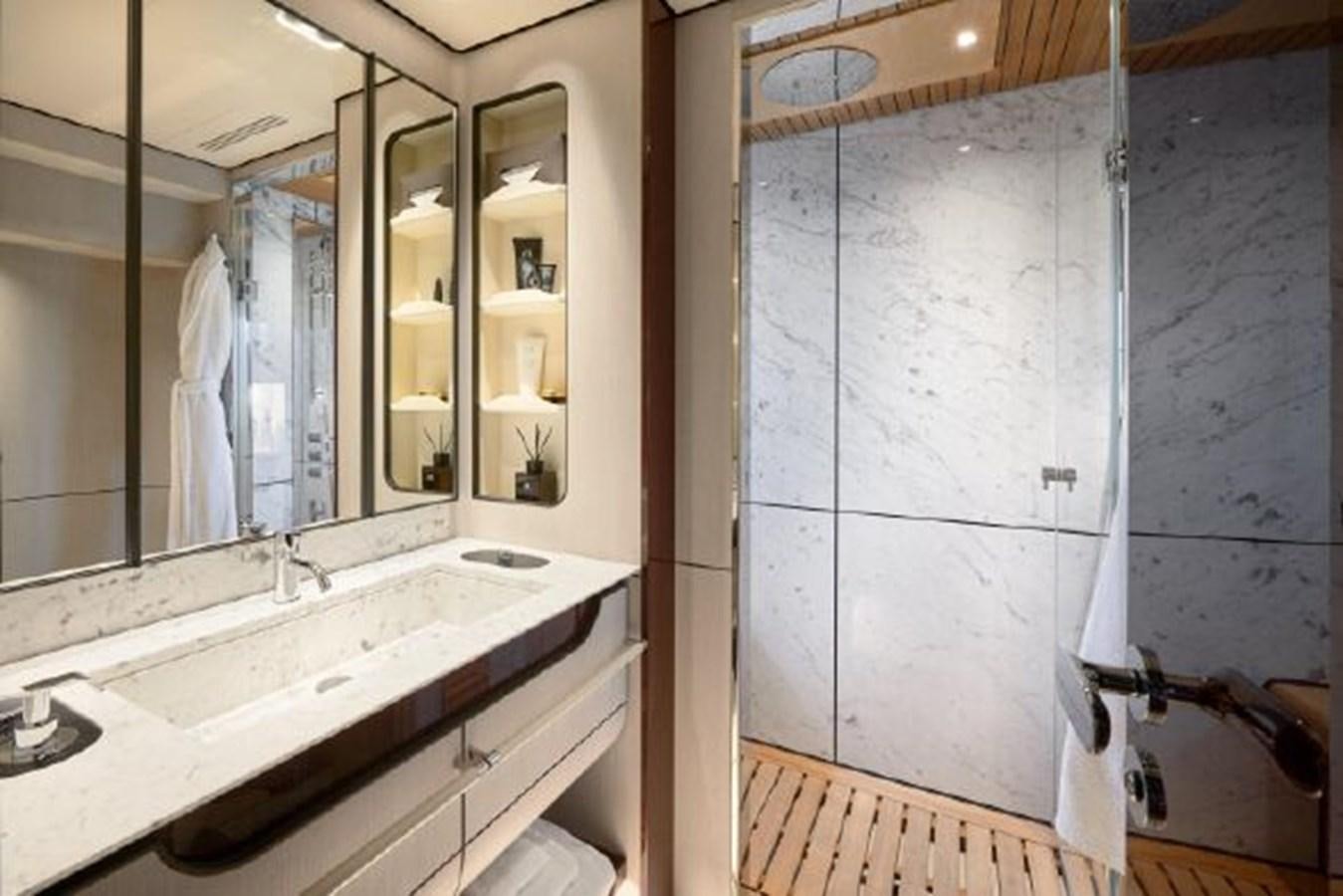 a bathroom with a sink and a mirror aboard 2019 AZIMUT GRANDE 35 METRI Yacht for Sale