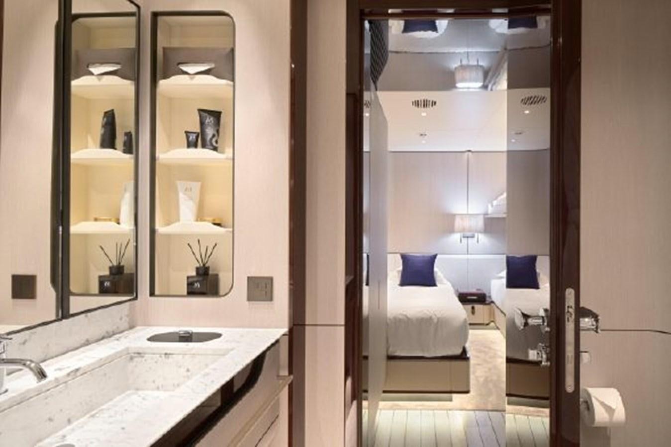 a bathroom with a sink and a bed aboard 2019 AZIMUT GRANDE 35 METRI Yacht for Sale
