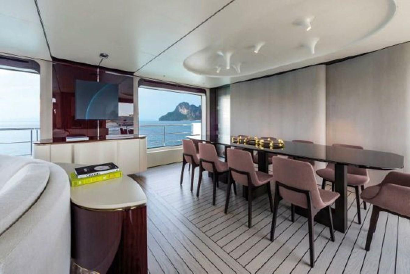 a room with a table and chairs aboard 2019 AZIMUT GRANDE 35 METRI Yacht for Sale