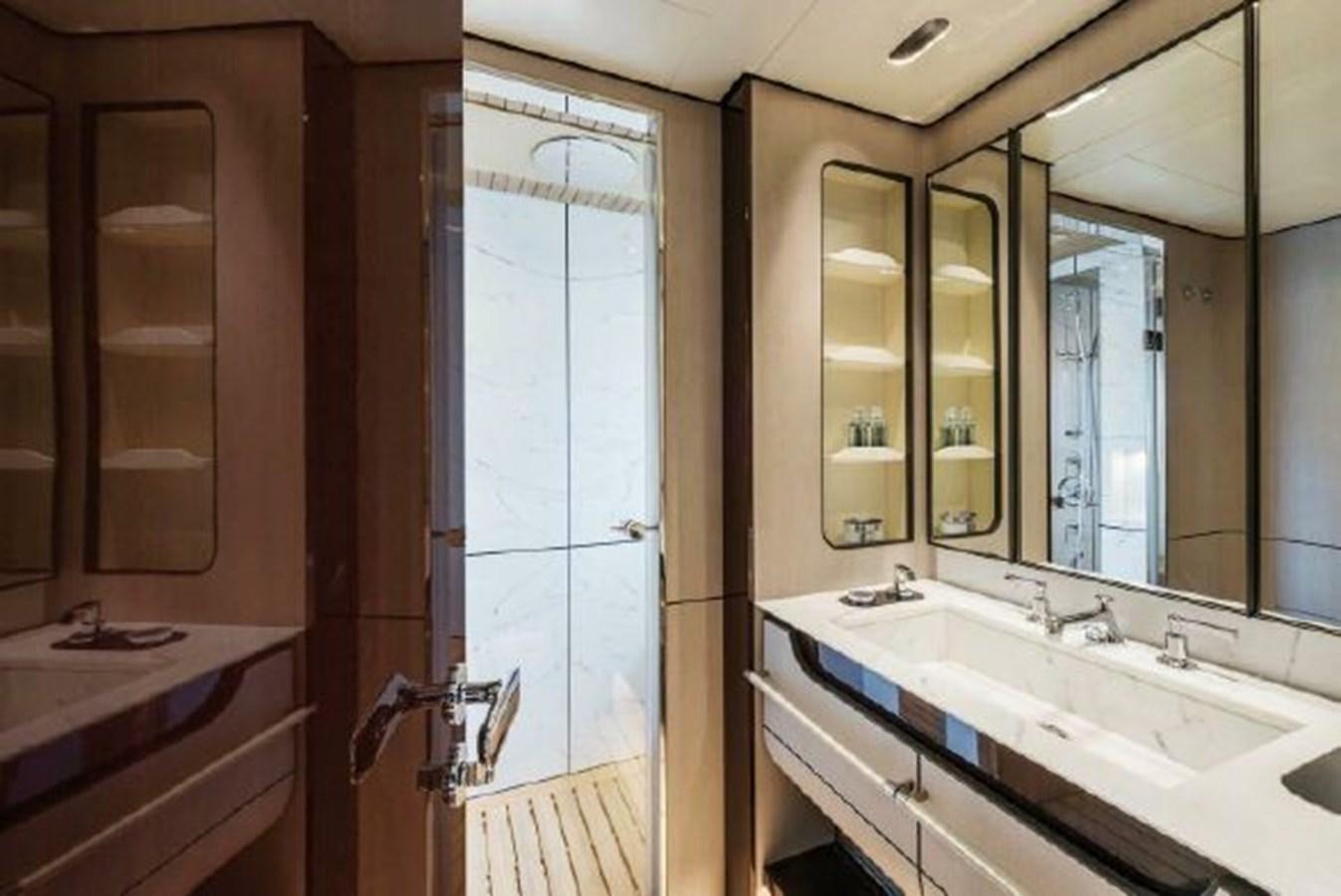 a bathroom with a large mirror aboard 2019 AZIMUT GRANDE 35 METRI Yacht for Sale