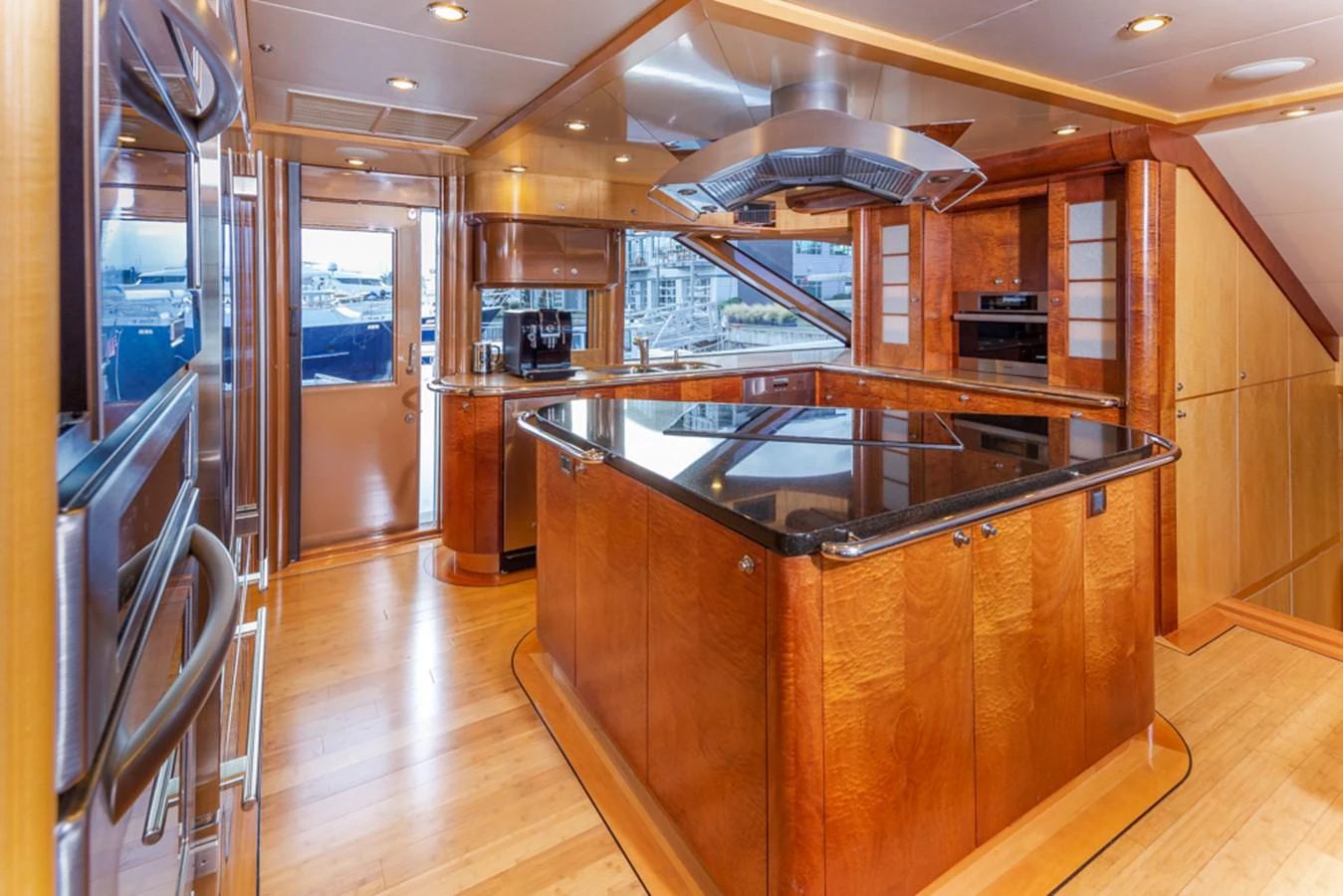 a kitchen with wooden cabinets aboard C JEWEL Yacht for Sale
