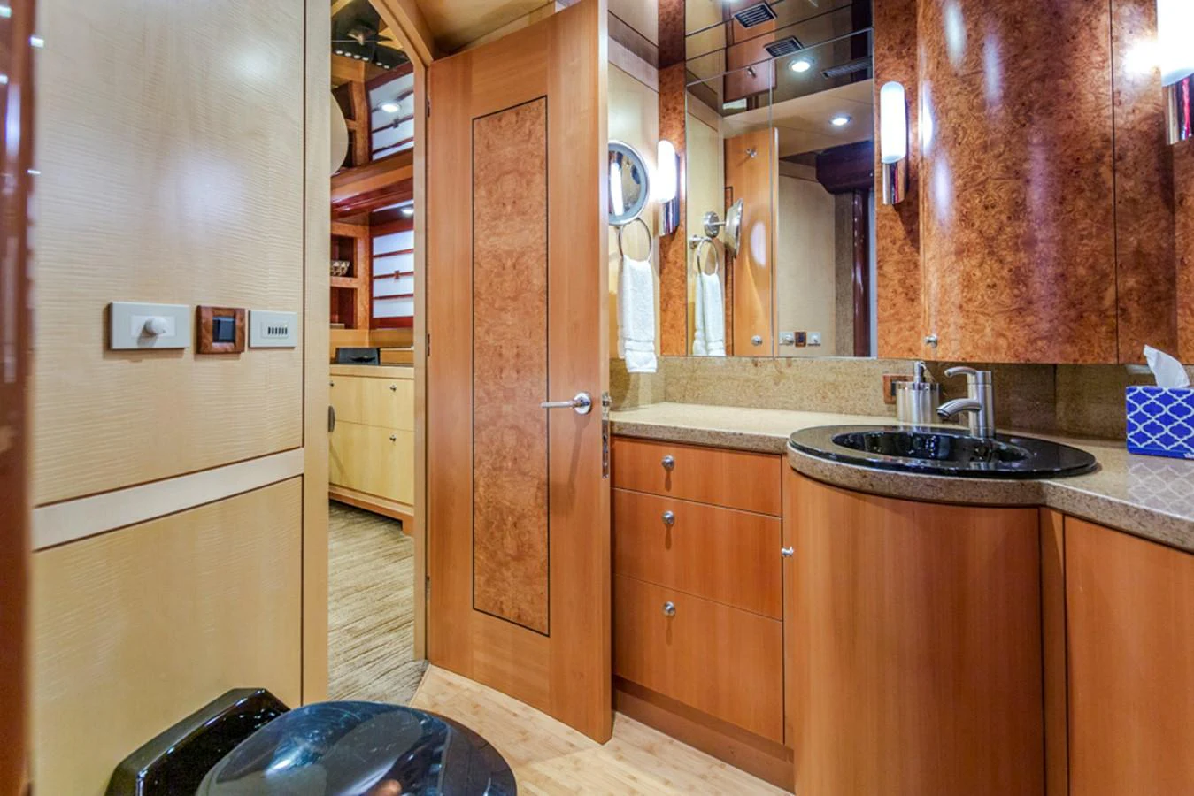 a kitchen with wooden cabinets aboard C JEWEL Yacht for Sale