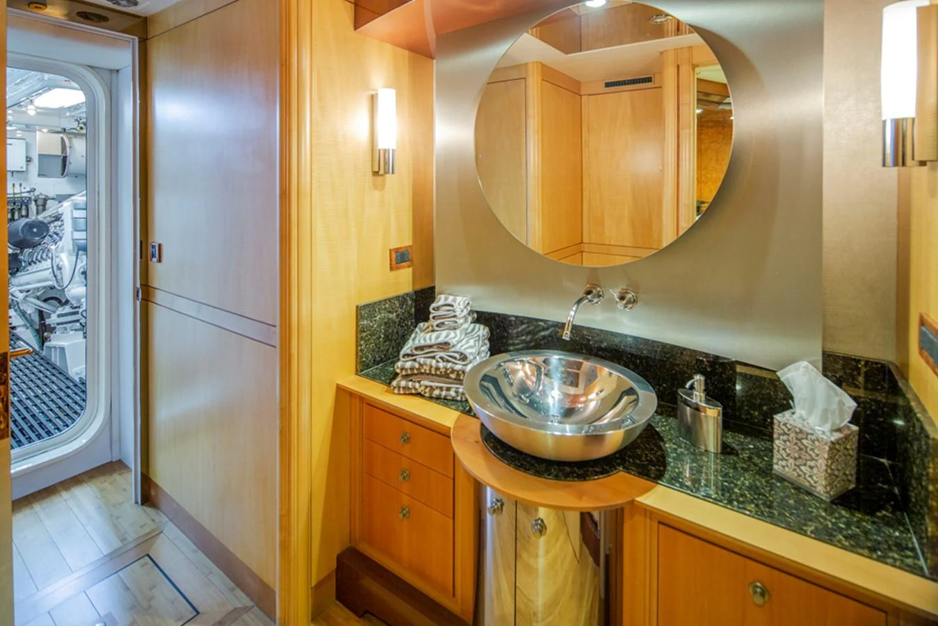 a bathroom with a sink and a mirror aboard C JEWEL Yacht for Sale