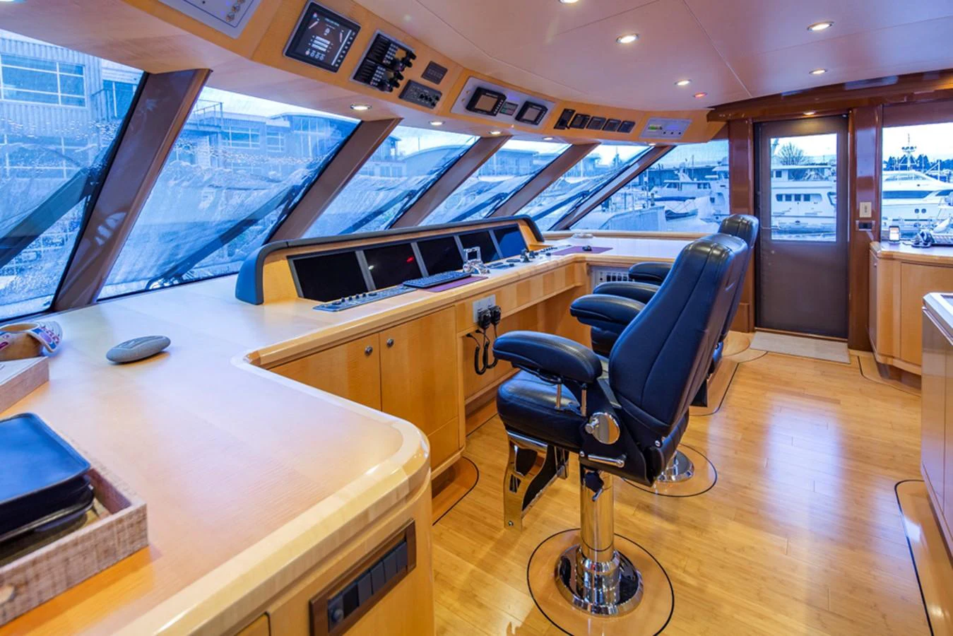 a room with a desk and chairs aboard C JEWEL Yacht for Sale