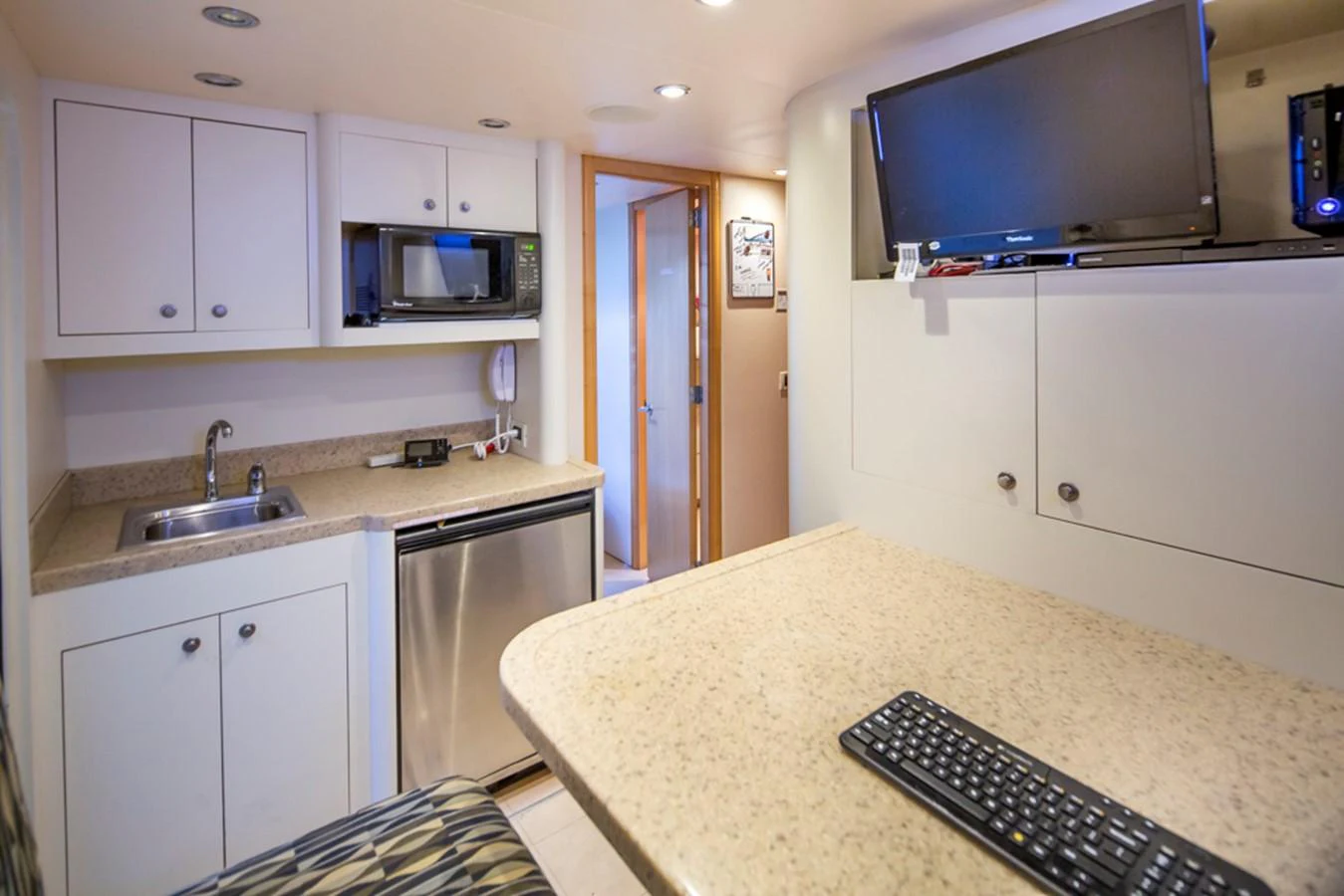 a kitchen with a large island aboard C JEWEL Yacht for Sale