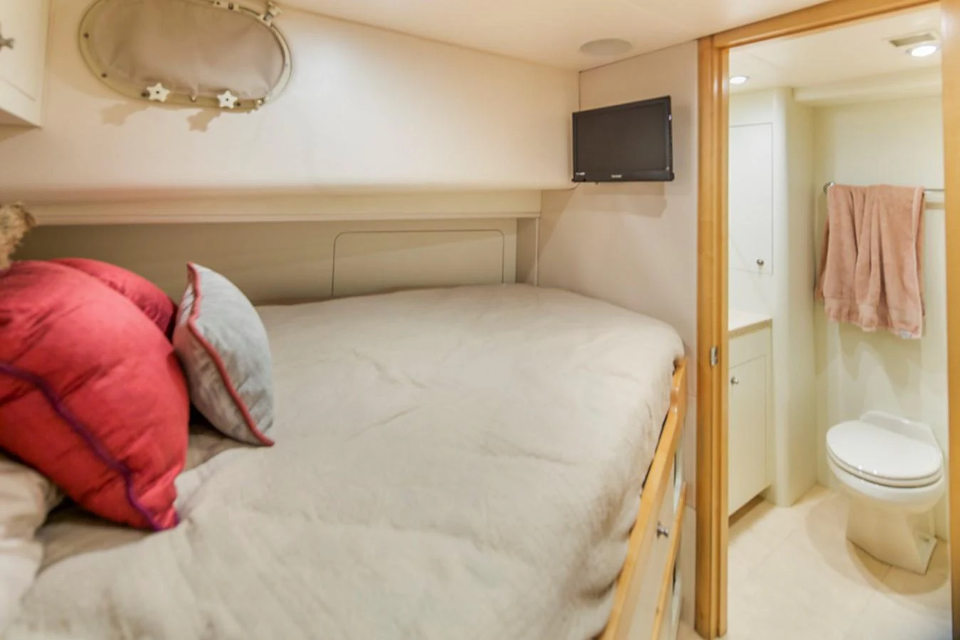a bedroom with a bed and a television aboard C JEWEL Yacht for Sale