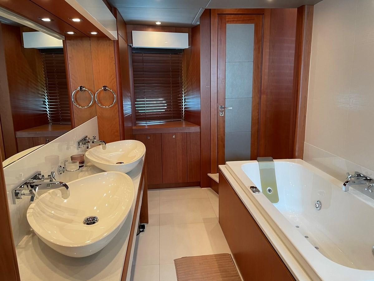 a bathroom with a tub sink and a sink aboard SUNSEEKER 115/03 Yacht for Sale