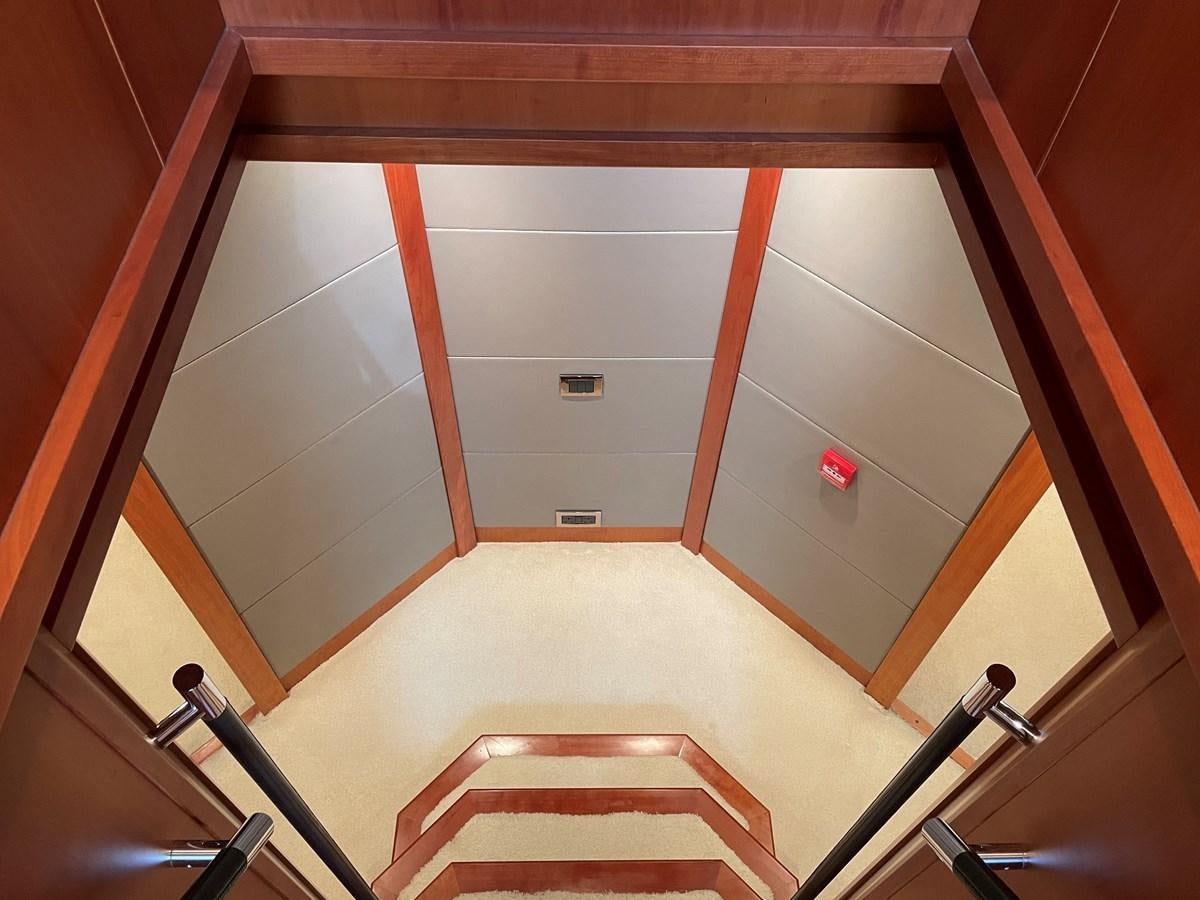 a room with a door and chairs aboard SUNSEEKER 115/03 Yacht for Sale