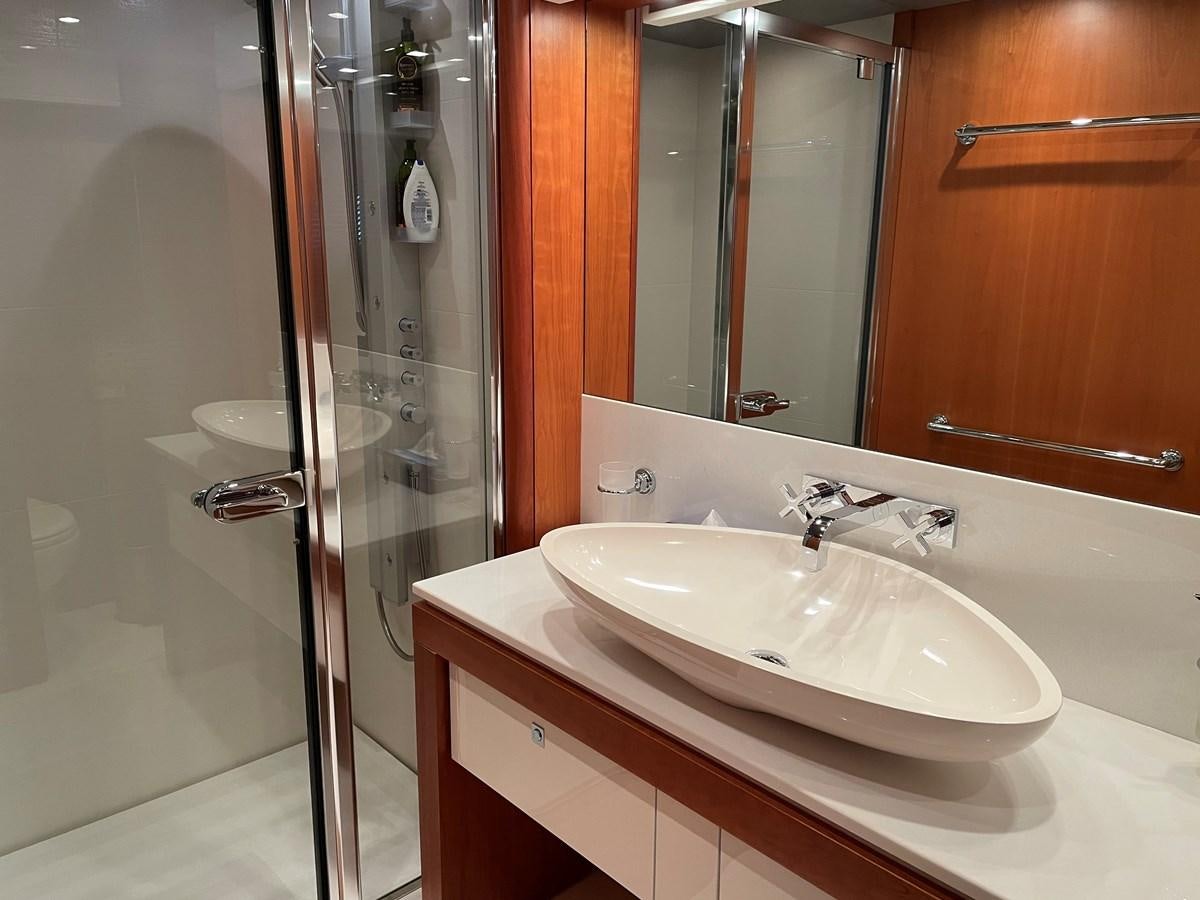 a bathroom with a sink and a shower aboard SUNSEEKER 115/03 Yacht for Sale