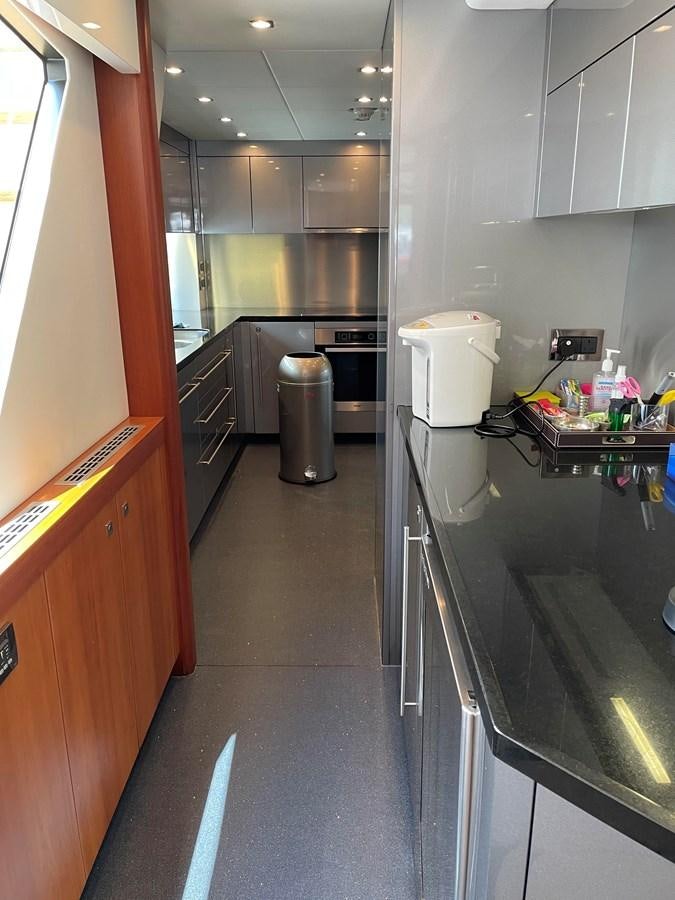 a kitchen with a stainless steel counter aboard SUNSEEKER 115/03 Yacht for Sale