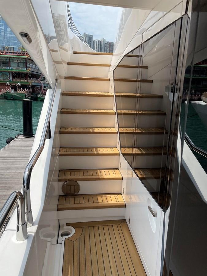 a white boat with wooden handles aboard SUNSEEKER 115/03 Yacht for Sale