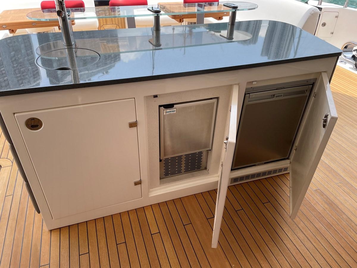 a kitchen with a large island aboard SUNSEEKER 115/03 Yacht for Sale