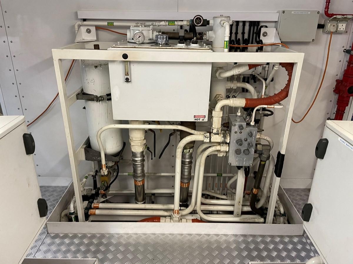 a white machine with a red cable aboard SUNSEEKER 115/03 Yacht for Sale