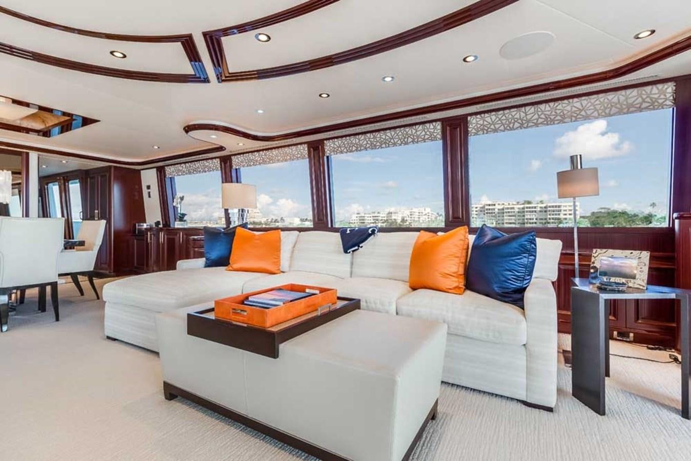 a large living room with a large window aboard OUR HERITAGE Yacht for Sale