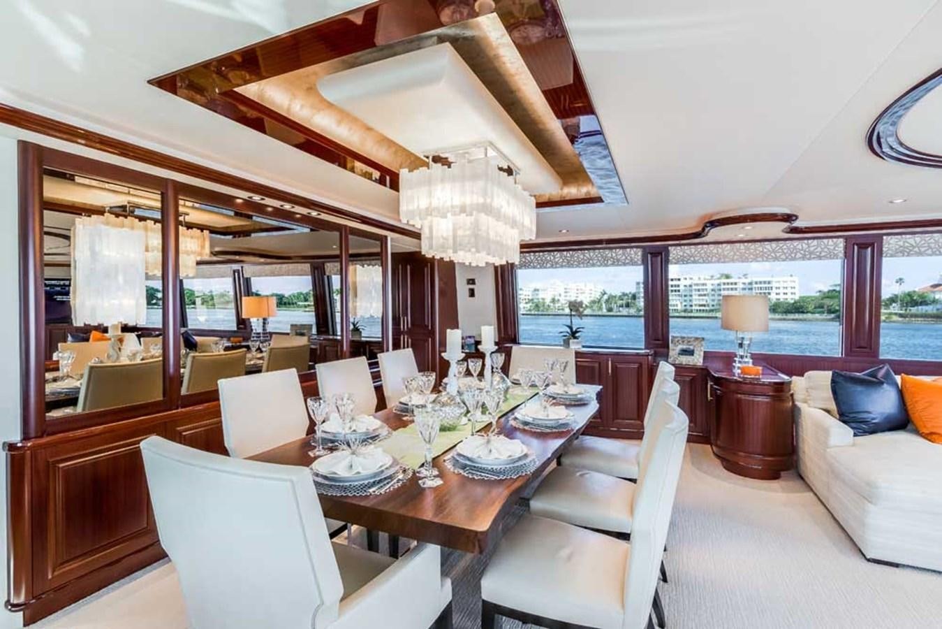 a dining room with a large window aboard OUR HERITAGE Yacht for Sale