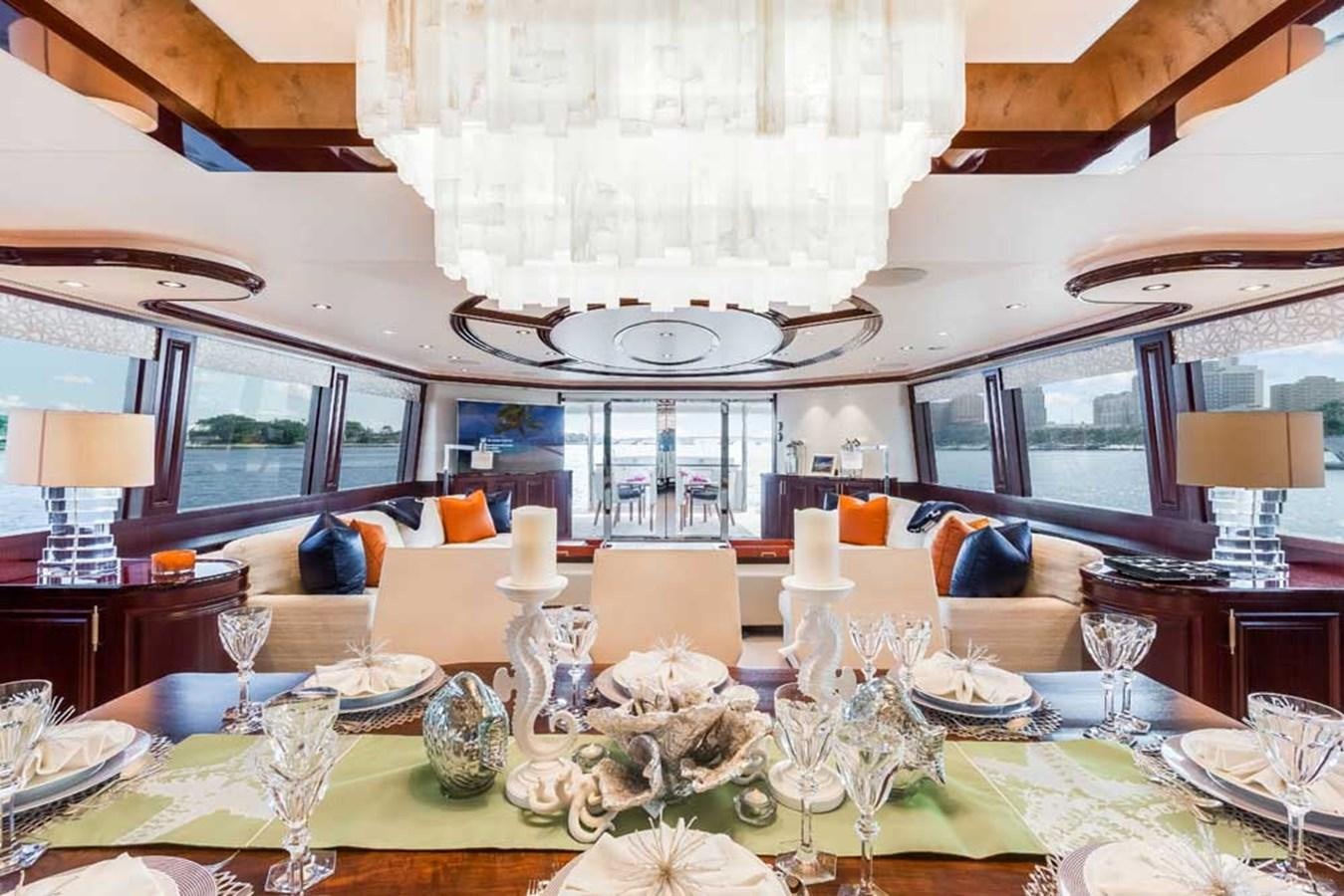 a large dining room table aboard OUR HERITAGE Yacht for Sale