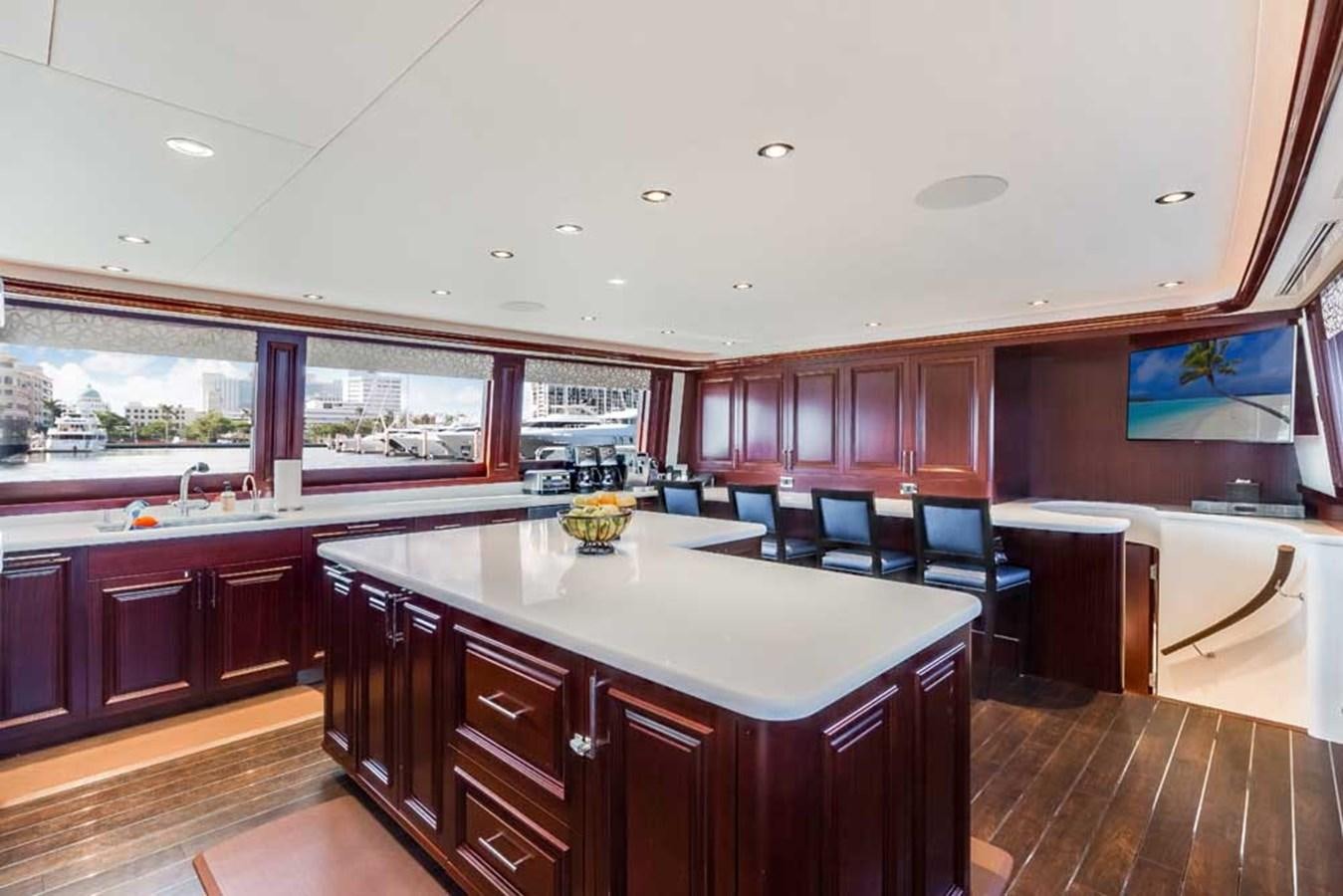 a kitchen with a large island aboard OUR HERITAGE Yacht for Sale
