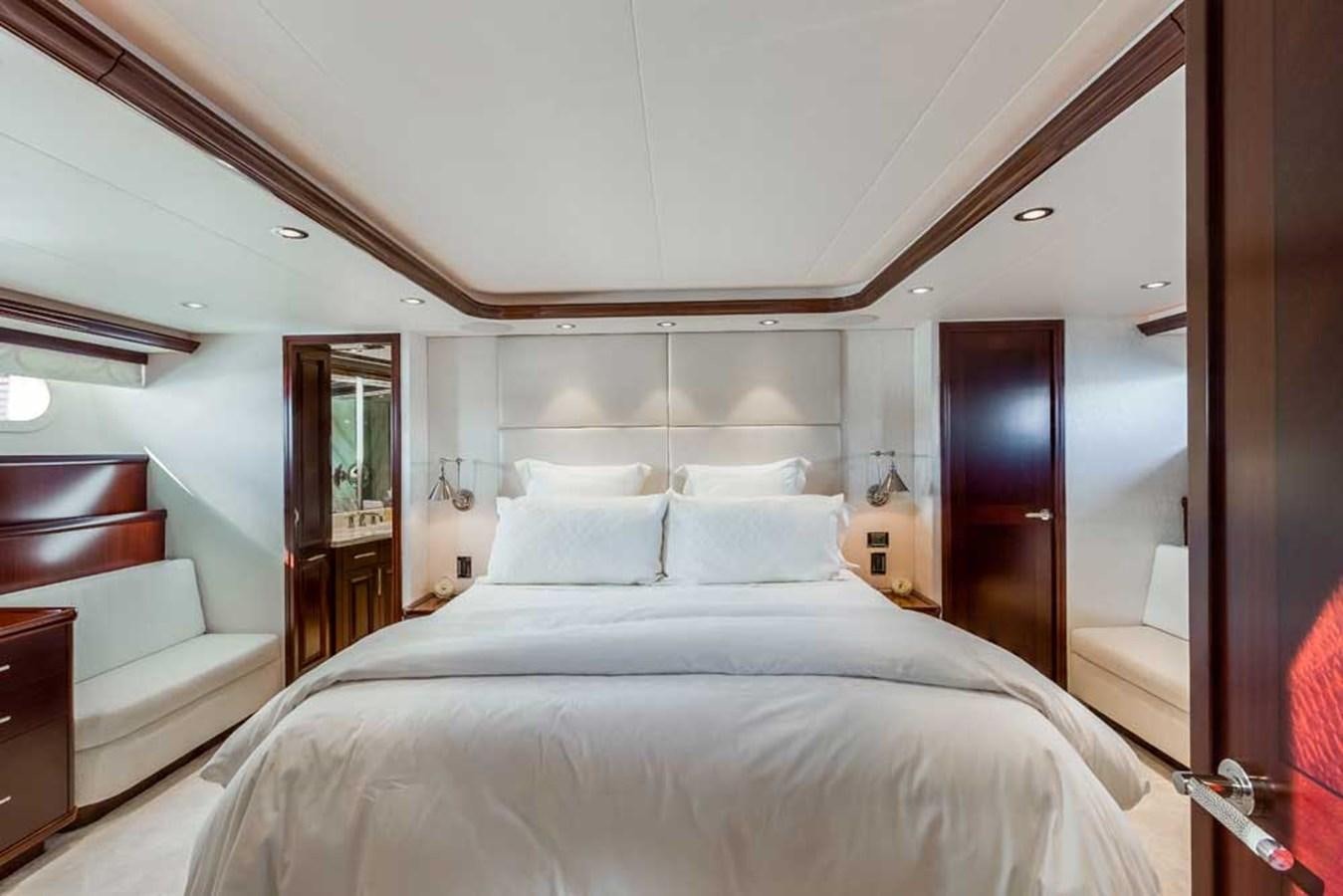 a large bed in a room aboard OUR HERITAGE Yacht for Sale
