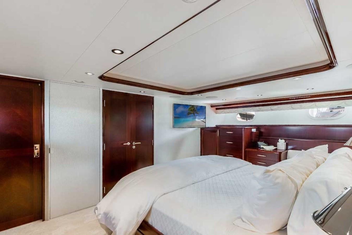 a room with a bed and a closet aboard OUR HERITAGE Yacht for Sale