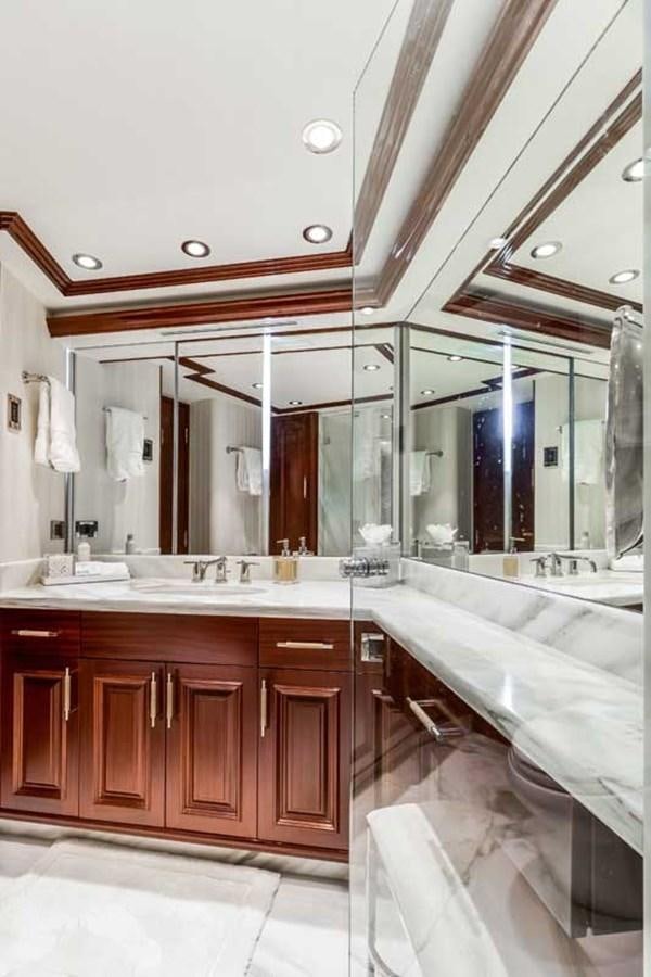 a bathroom with a large mirror aboard OUR HERITAGE Yacht for Sale
