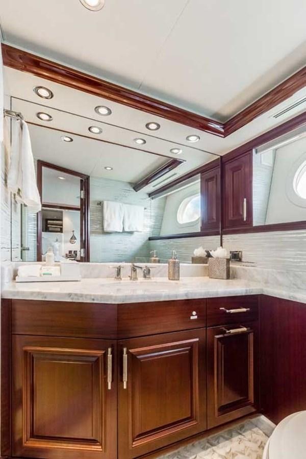 a bathroom with a large mirror aboard OUR HERITAGE Yacht for Sale