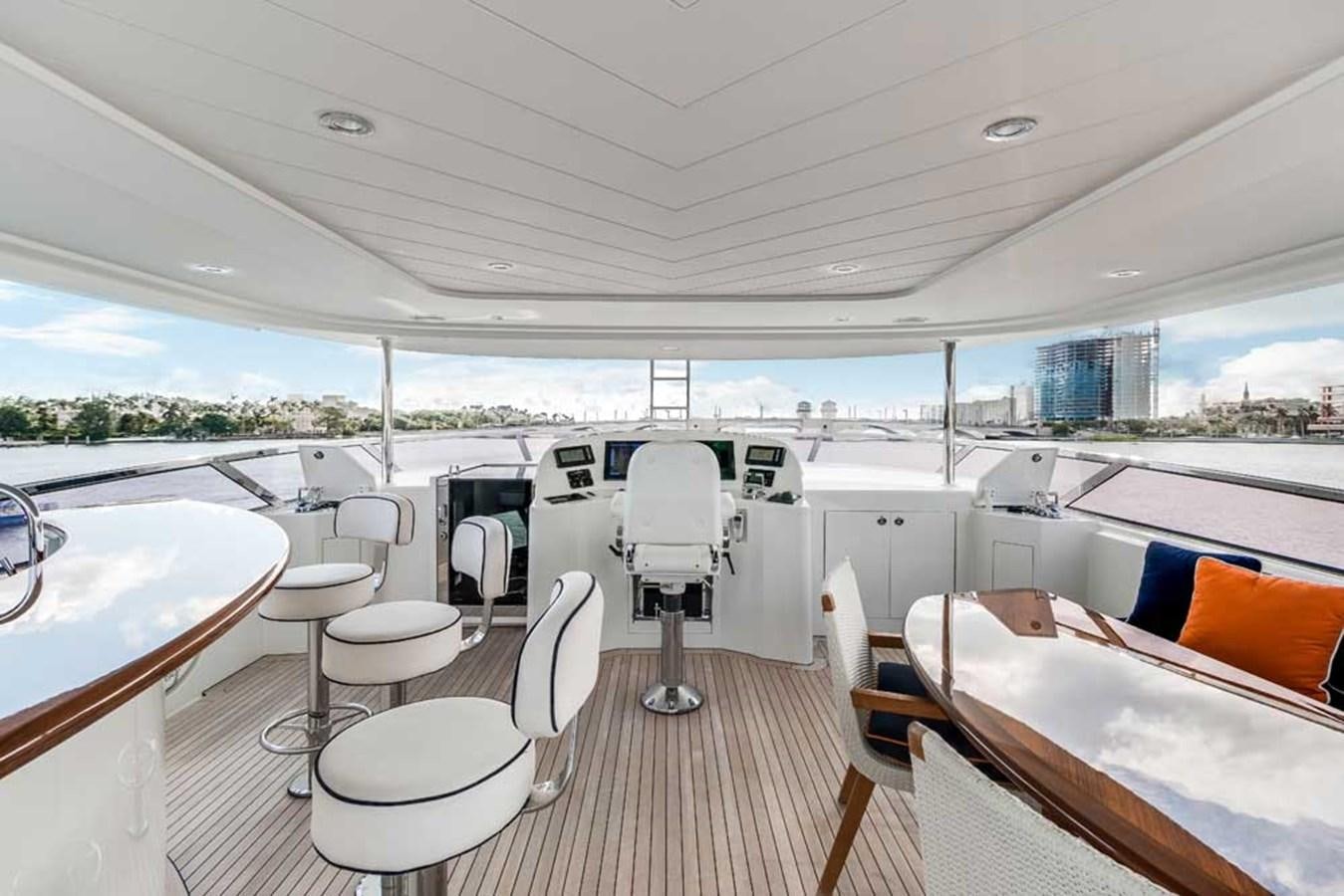 a boat with a table and chairs aboard OUR HERITAGE Yacht for Sale