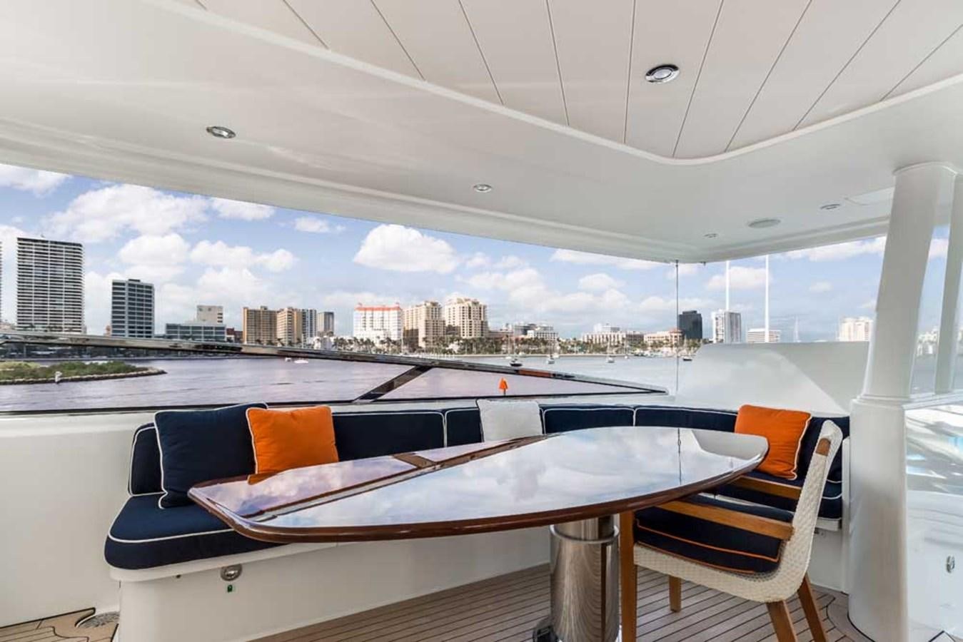 a table and chairs on a boat aboard OUR HERITAGE Yacht for Sale
