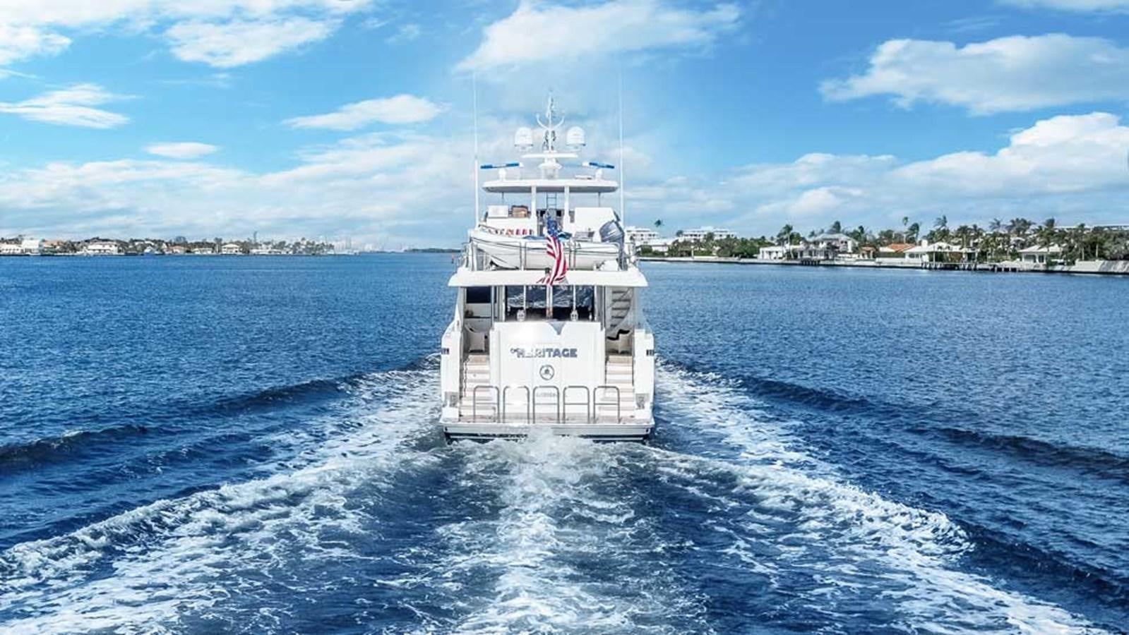a white boat on the water aboard OUR HERITAGE Yacht for Sale